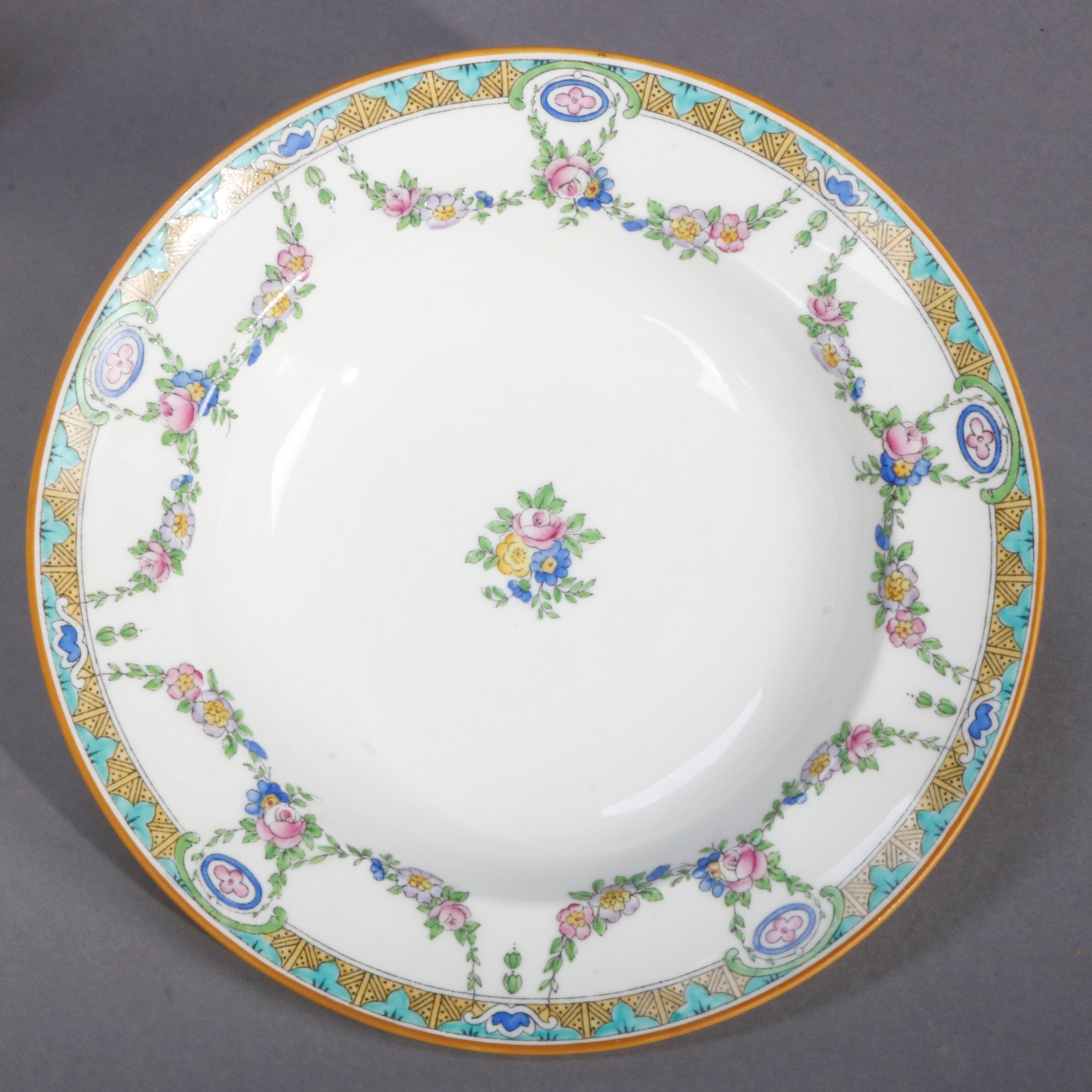 A set of 11 English Mintons Fine China wide rim bowls feature rim with floral swag and stylized foliate border, central floral spray, en verso crown maker mark as photographed, 20th century

Measures- 1.5