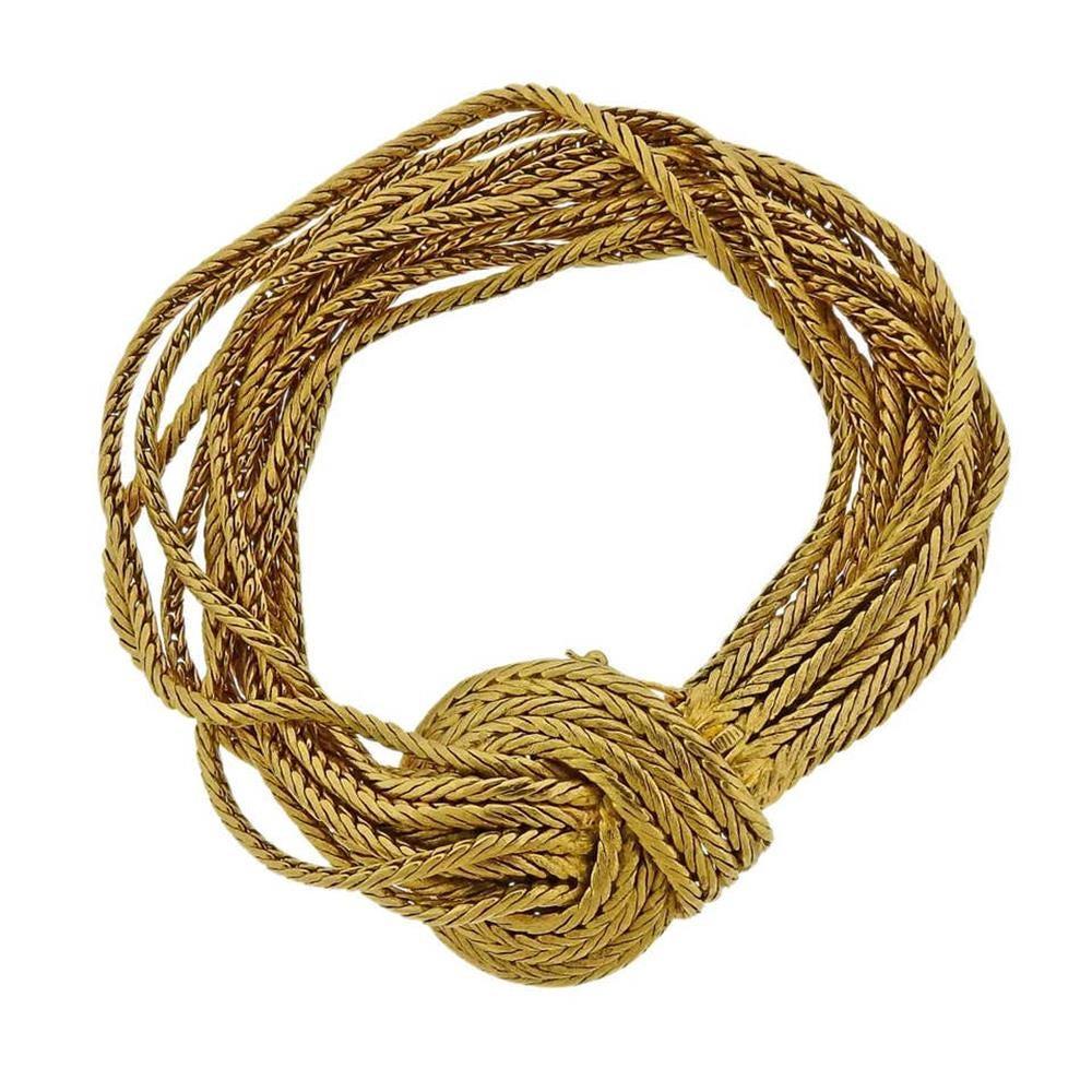 18k yellow gold woven bracelet, featuring 11 strands. Bracelet is 7.5