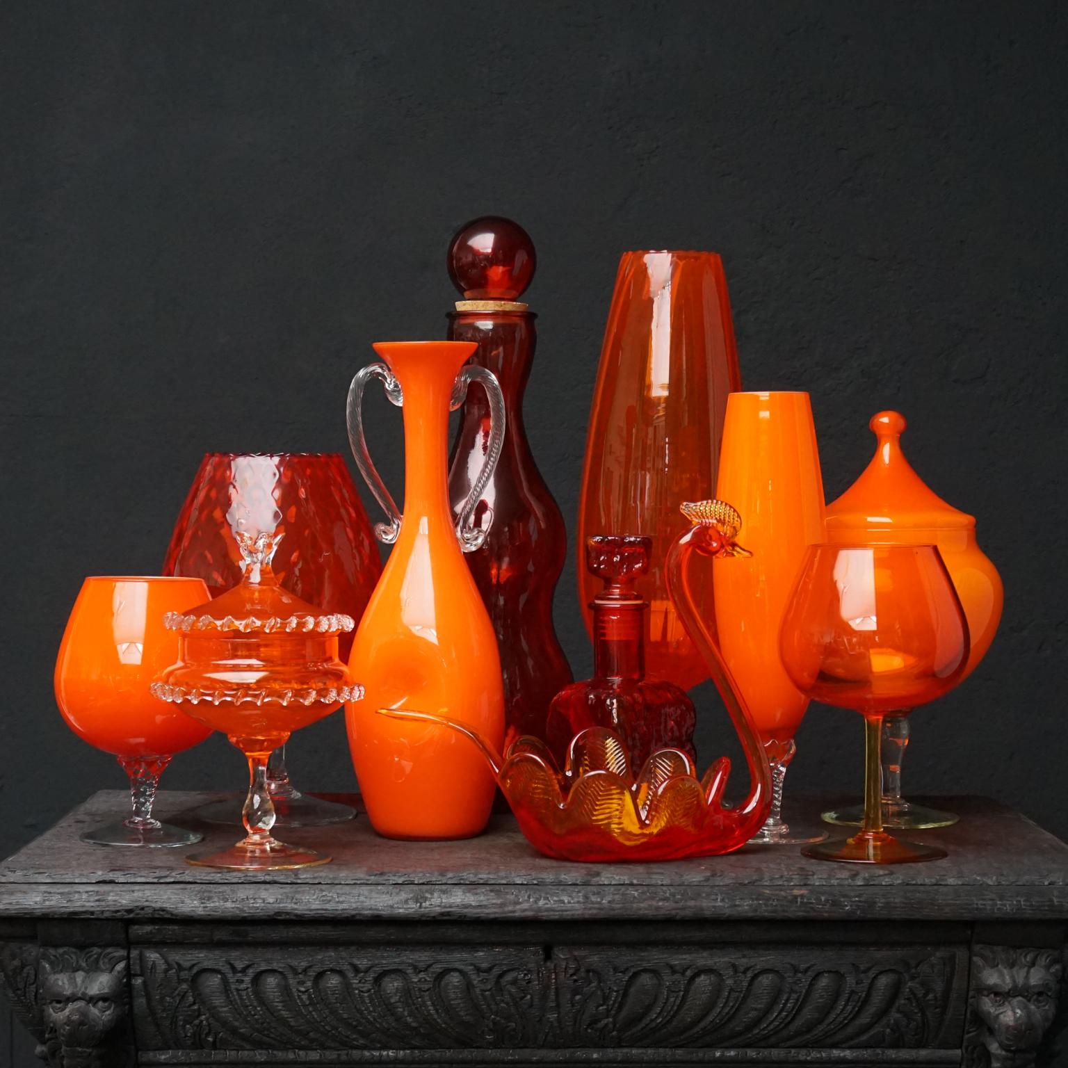 Very pretty set of extra large eleven 1960s Italian Empoli Rossini and Opalina Fiorentina cased glass decanters, carafe, vases, apothecary jars and a swan dish. In the ever-popular colour Tangerine, a mixture of different shades of orange in