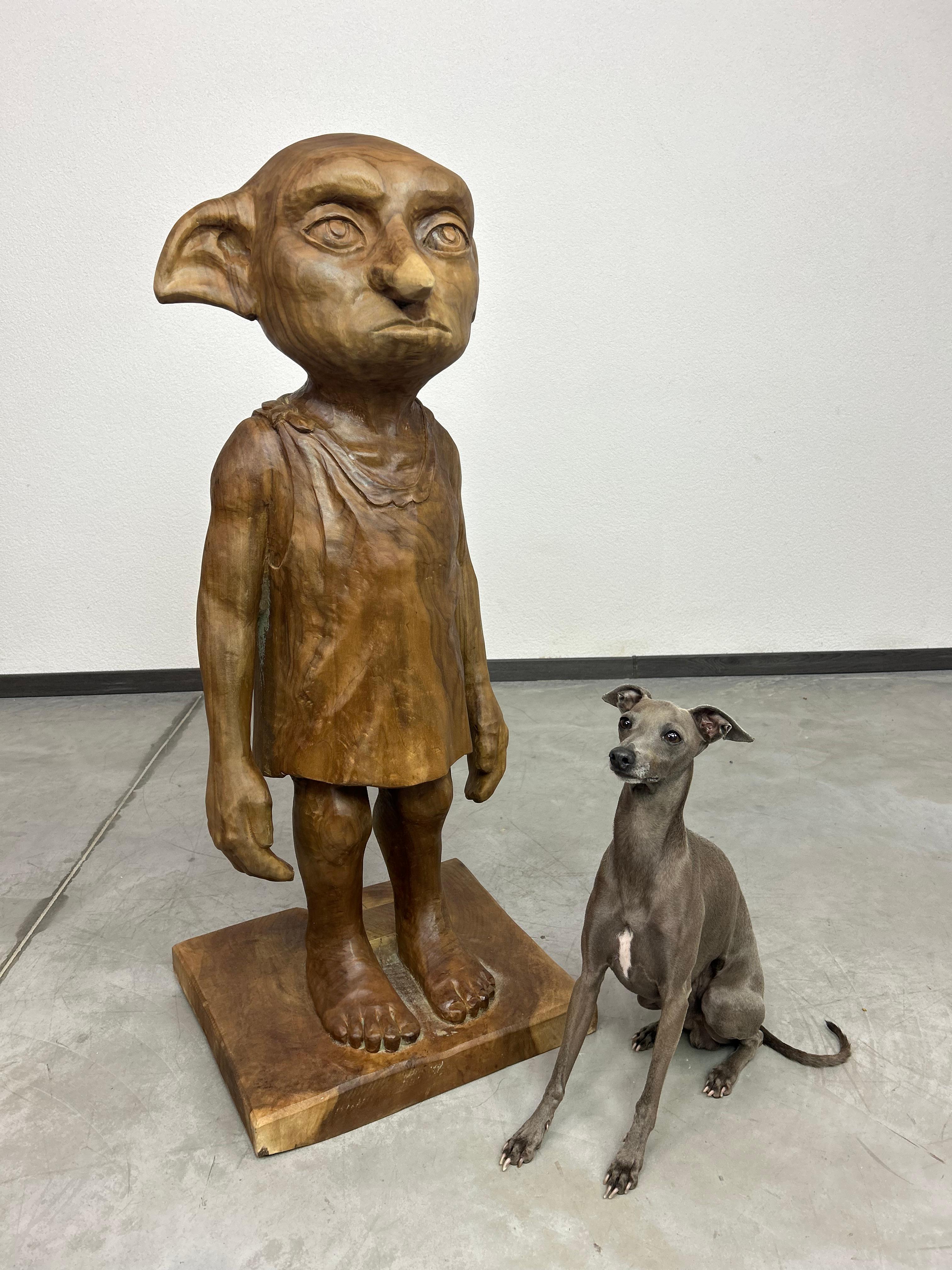 Elf Doby from Harry Potter series hand carved from a walnut tree in real life size.