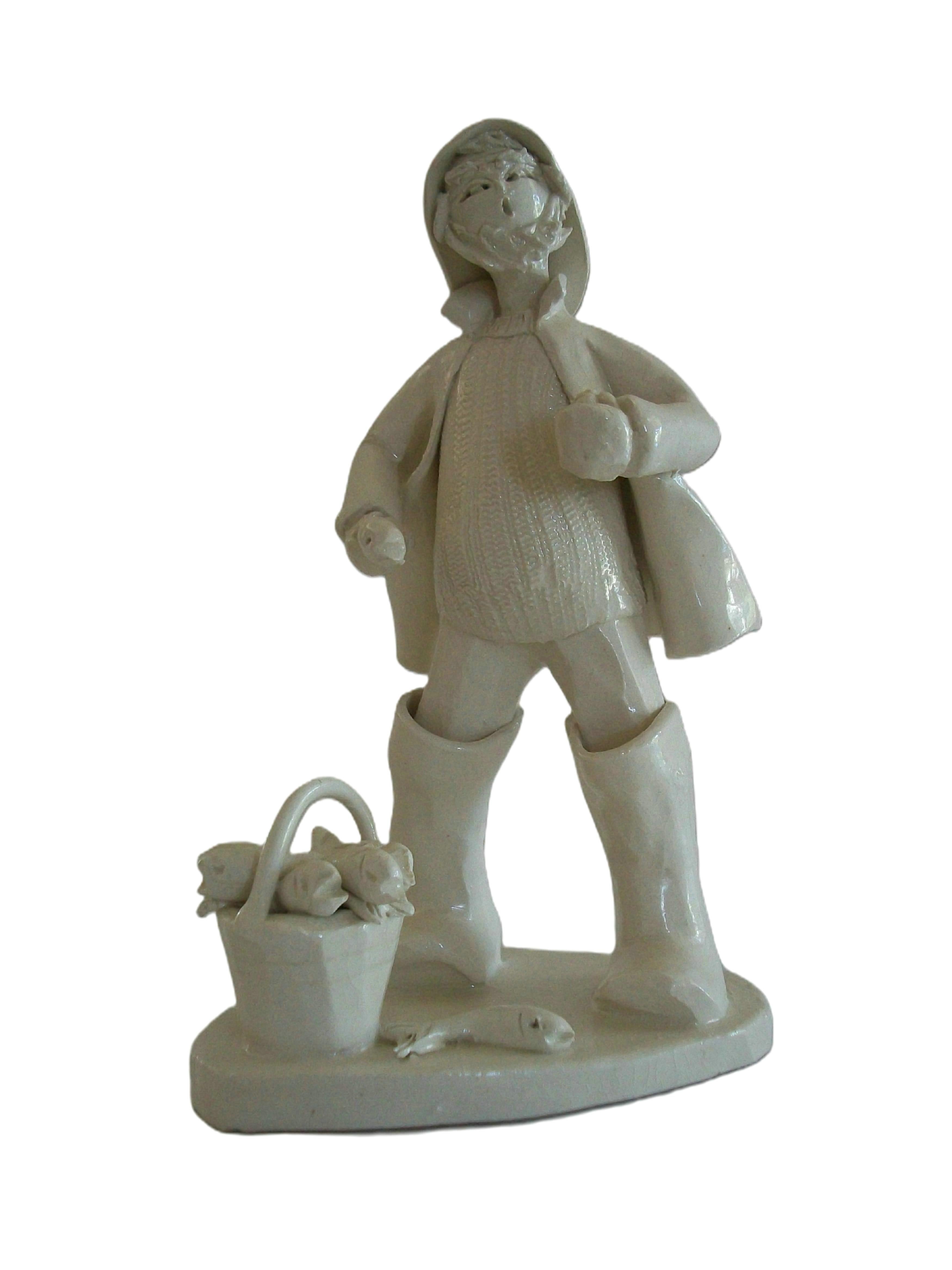 ELFRIEDE MEINDL (1926-2020) - Fine vintage folk art ceramic figure of an Atlantic fisherman on a plinth base - small size - featuring elaborate hand made and hand crafted details throughout including the day's catch of fish in a bucket, a cable knit