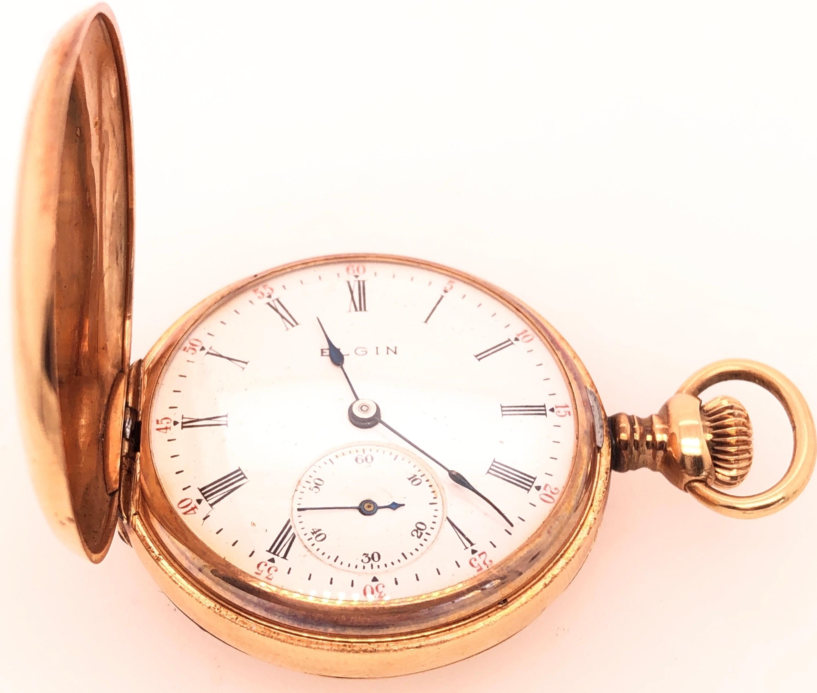 This beautiful antique Elgin pocket watch circa 1895 is a true collectible. The hunting case has an inner dust cover and is set with a beautiful round diamond. It is 32 mm diameter, case no.836602 movement no. 11289658. This watch is in fine working