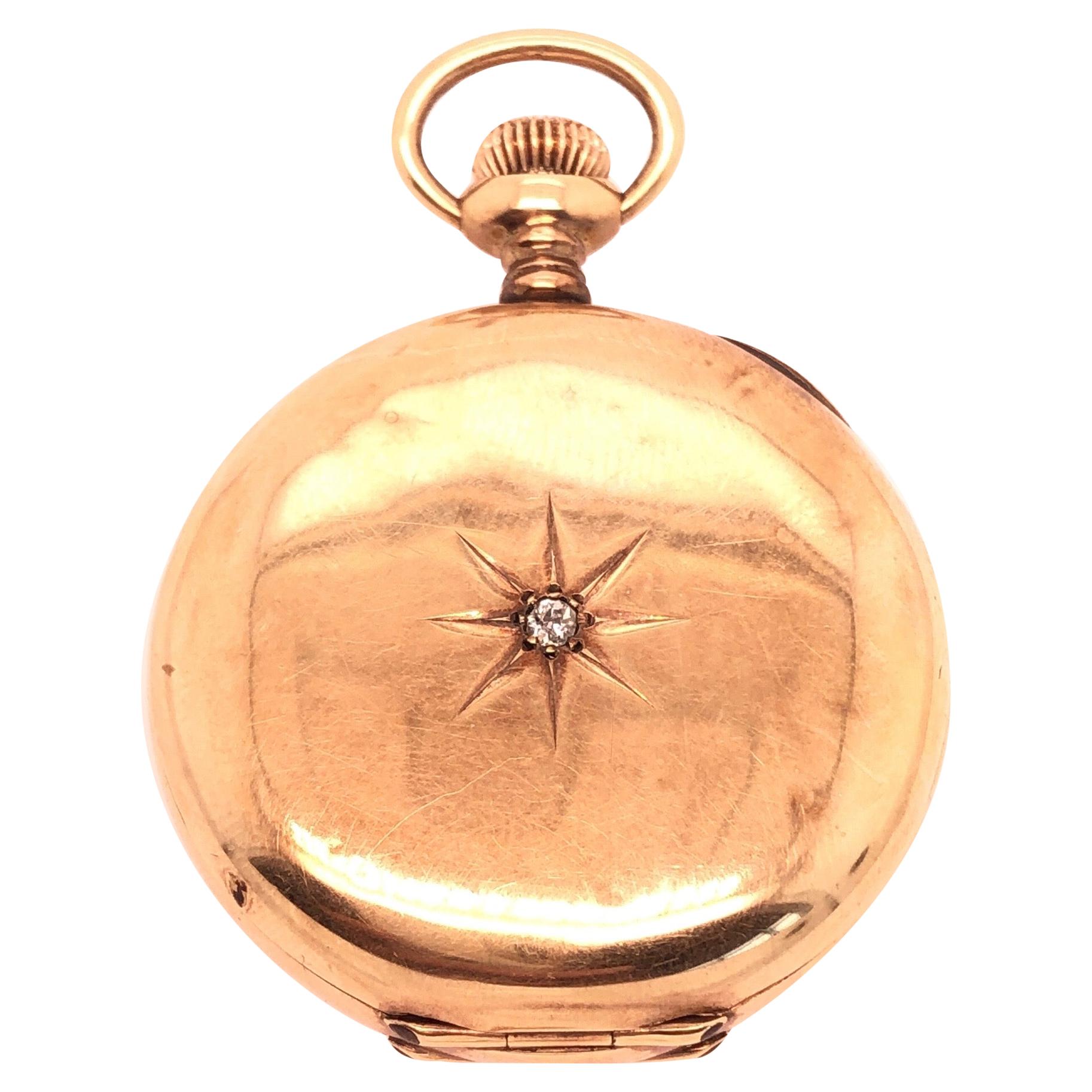 Reloj de bolsillo Elgin de oro de 14 quilates y diamantes