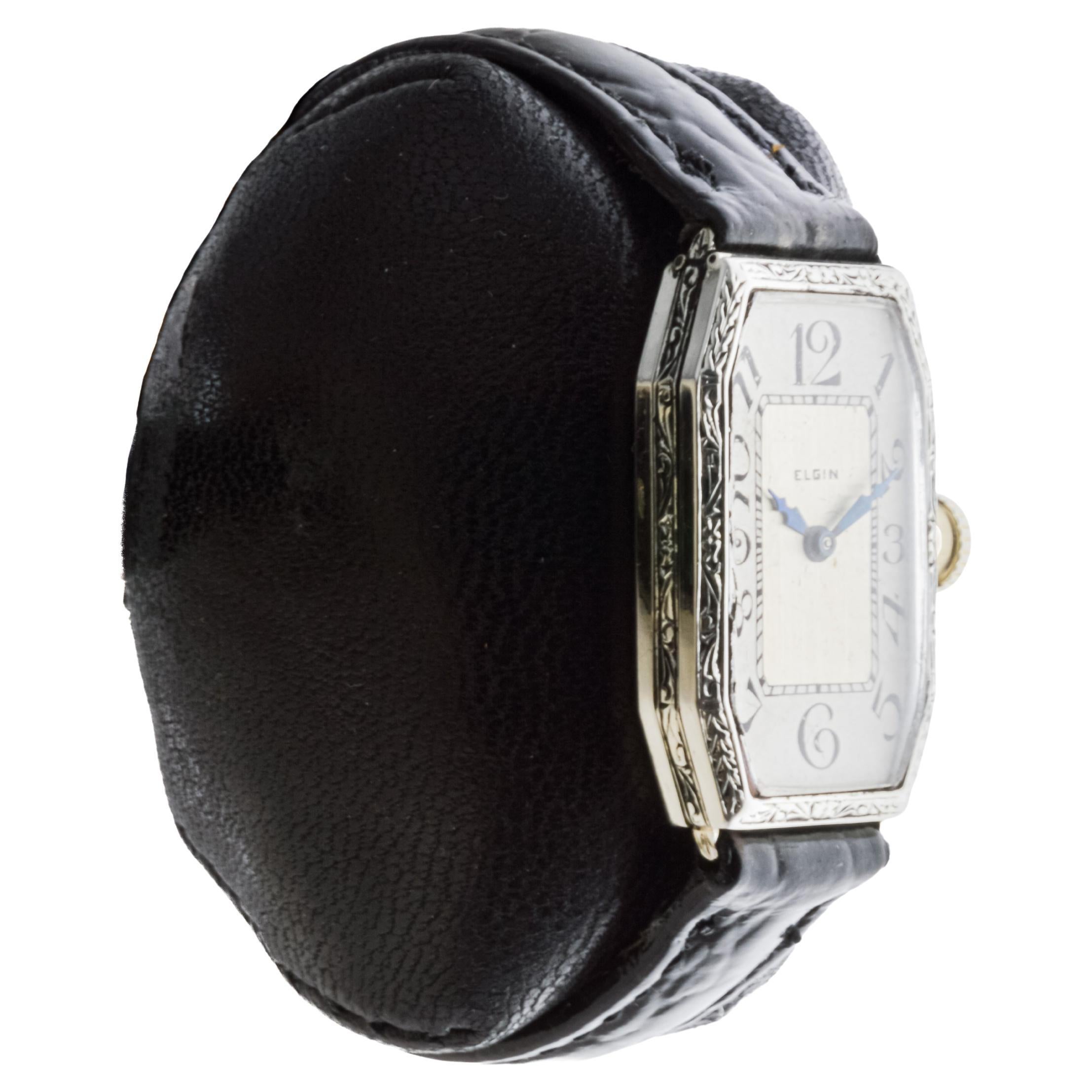 FACTORY / HOUSE: Elgin Watch Company
STYLE / REFERENCE: Art Deco / Tank Style 
METAL / MATERIAL: 14Kt Solid White Gold
CIRCA / YEAR: 1920's
DIMENSIONS / SIZE: Length 32mm X Width 18mm
MOVEMENT / CALIBER: Manual Winding / 17 Jewels 
DIAL / HANDS: