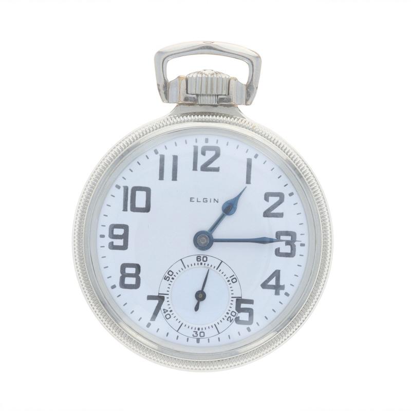 Brand: Elgin
Model: 15 B.W. Raymond
Movement: Mechanical
Number of Jewels: 21
Year: 1923
Dial Color: White

Grade: 478
Size: 16s

Metal Content: 14k White Gold Filled

Style: Open Face
Features: 
Sub dial at the 6 o'clock position 
Numbers marking