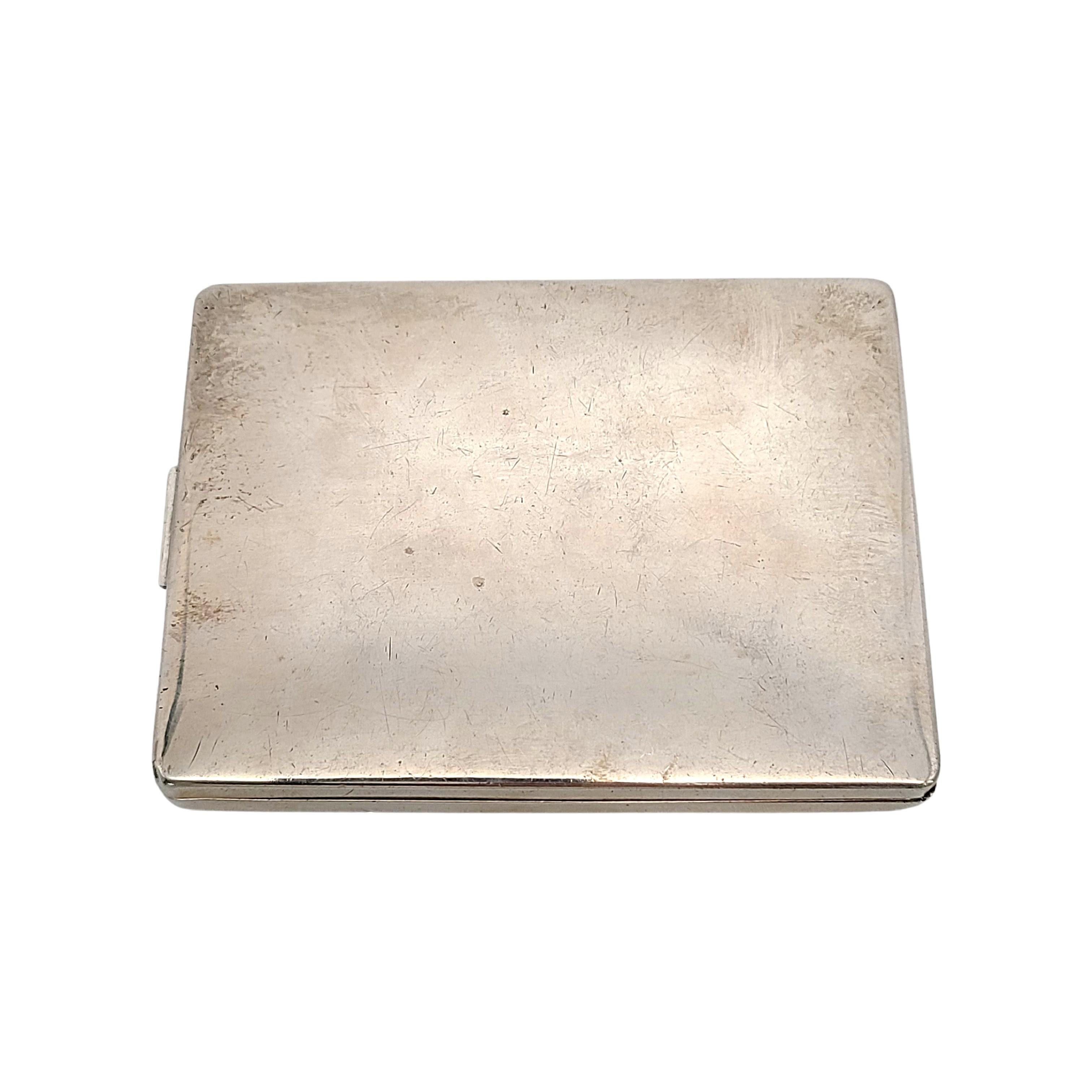 Sterling silver cigarette case by Elgin American, with monogram.

Monogram appears to be EBJ

Features a smooth polished finish with etched floral border on the front around the monogram at the center. Interior features an engine turned overlapping