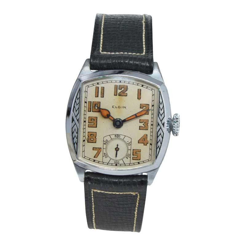 FACTORY / HOUSE: Elgin Watch Company
STYLE / REFERENCE: Cushion Shape 
METAL / MATERIAL: Steel on Chromium
CIRCA / YEAR: 1929
DIMENSIONS / SIZE: Length 34mm x Width 30mm
MOVEMENT / CALIBER: Manual Winding / 7 Jewels 
DIAL / HANDS: Silvered with