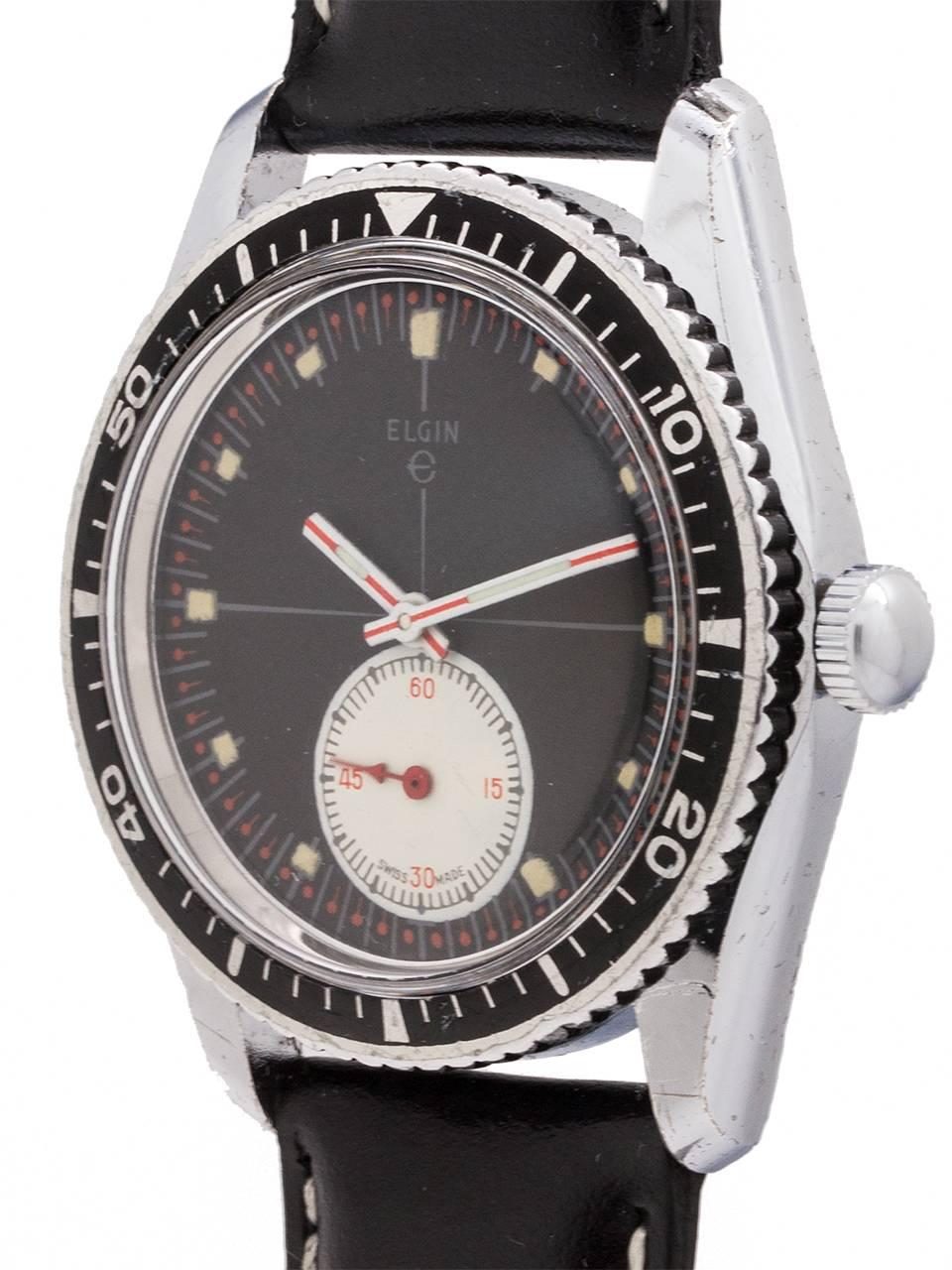 
A great looking vintage Elgin diver’s model circa 1960’s with super cool graphics! Featuring a 36mm diameter case with screw down back, steel rotating bezel with black elapsed time insert, acrylic crystal, and great looking black original dial with