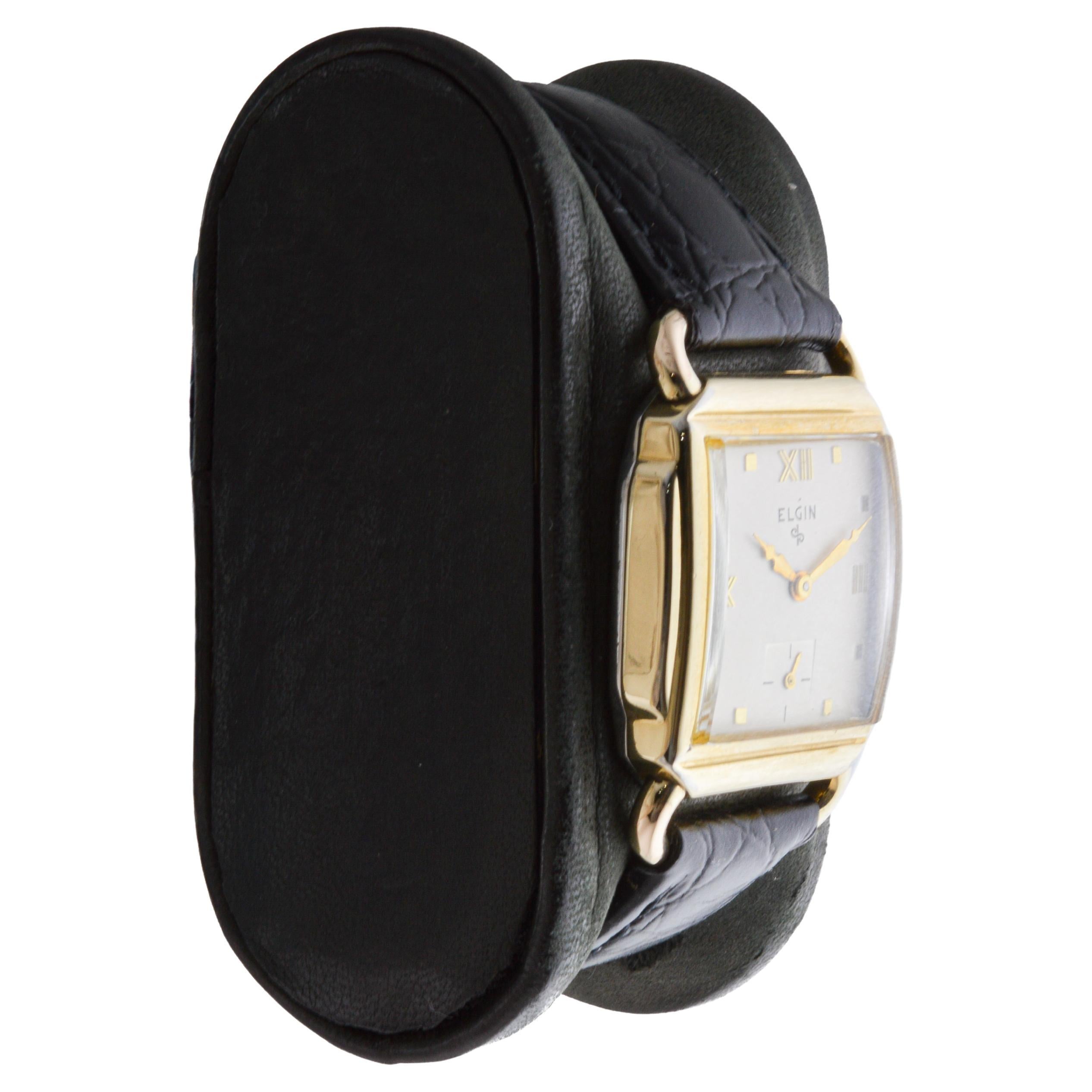FACTORY / HOUSE: Elgin Watch Company
STYLE / REFERENCE: Art Deco / Tank Style 
METAL / MATERIAL: Yellow Gold Filled 
CIRCA / YEAR: 1940's
DIMENSIONS / SIZE: Length 36mm X Width 25mm
MOVEMENT / CALIBER: Manual Winding / 15 Jewels / Caliber 554
DIAL /