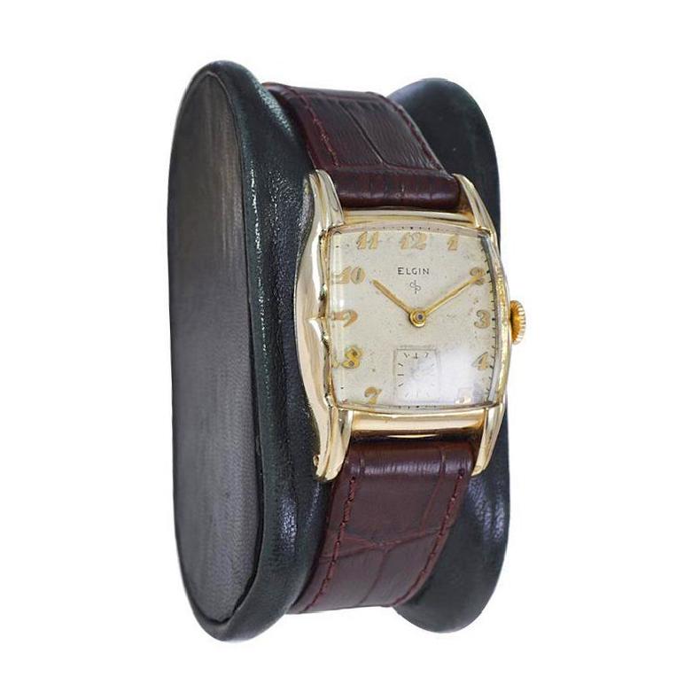 FACTORY / HOUSE: Elgin Watch Company
STYLE / REFERENCE: Tortue Shape / Art Deco / Reference 0728
METAL / MATERIAL: Yellow Gold Filled 
CIRCA / YEAR: 1950's
DIMENSIONS / SIZE: Length 34mm x Width 26mm
MOVEMENT / CALIBER: Manual Winding / 15 Jewels