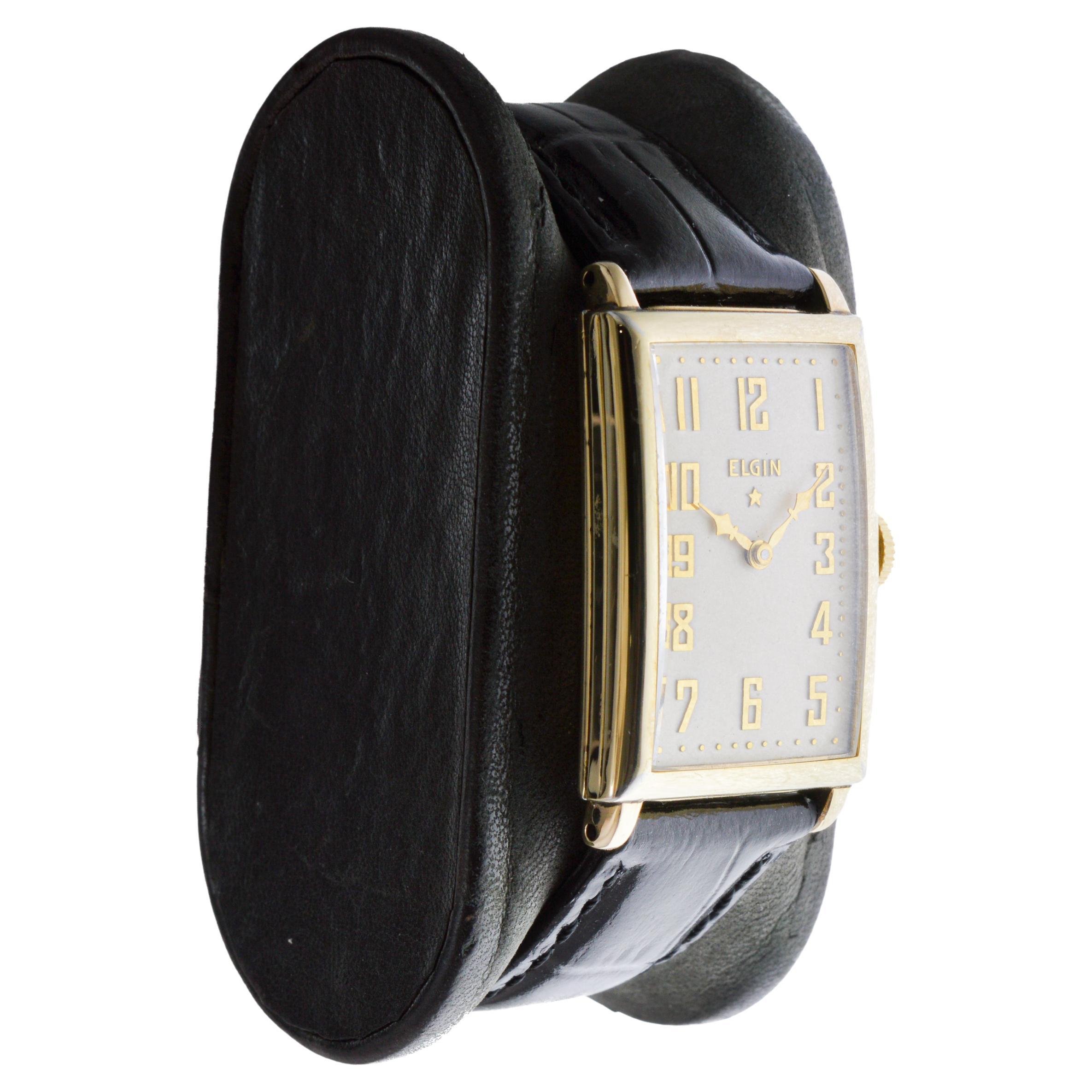 FACTORY / HOUSE: Elgin watch Company
STYLE / REFERENCE: Art Deco / Tank Style
METAL / MATERIAL: Yellow Gold Filled
CIRCA / YEAR: 1920's
DIMENSIONS / SIZE: Length 38mm X Width 22m
MOVEMENT / CALIBER: Manual Winding / 17 Jewels / Caliber 18-0 
DIAL /