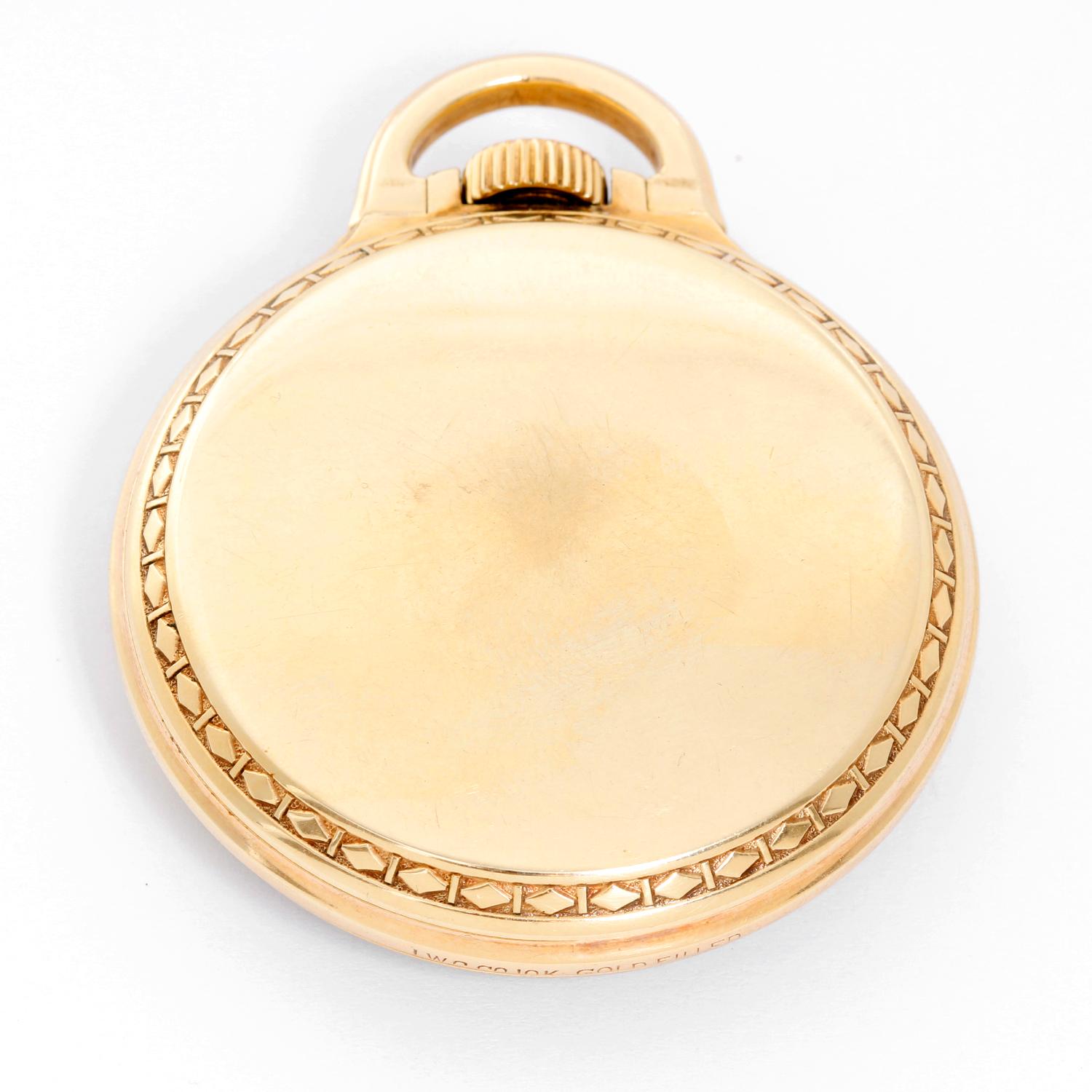 Elgin  BW Raymond Gold Filled Pocket Watch - Manual winding; 21 jewels. Gold filled . White enamel single sunk dial with Arabic numerals . Pre-owned with custom box. Railroad approved. 