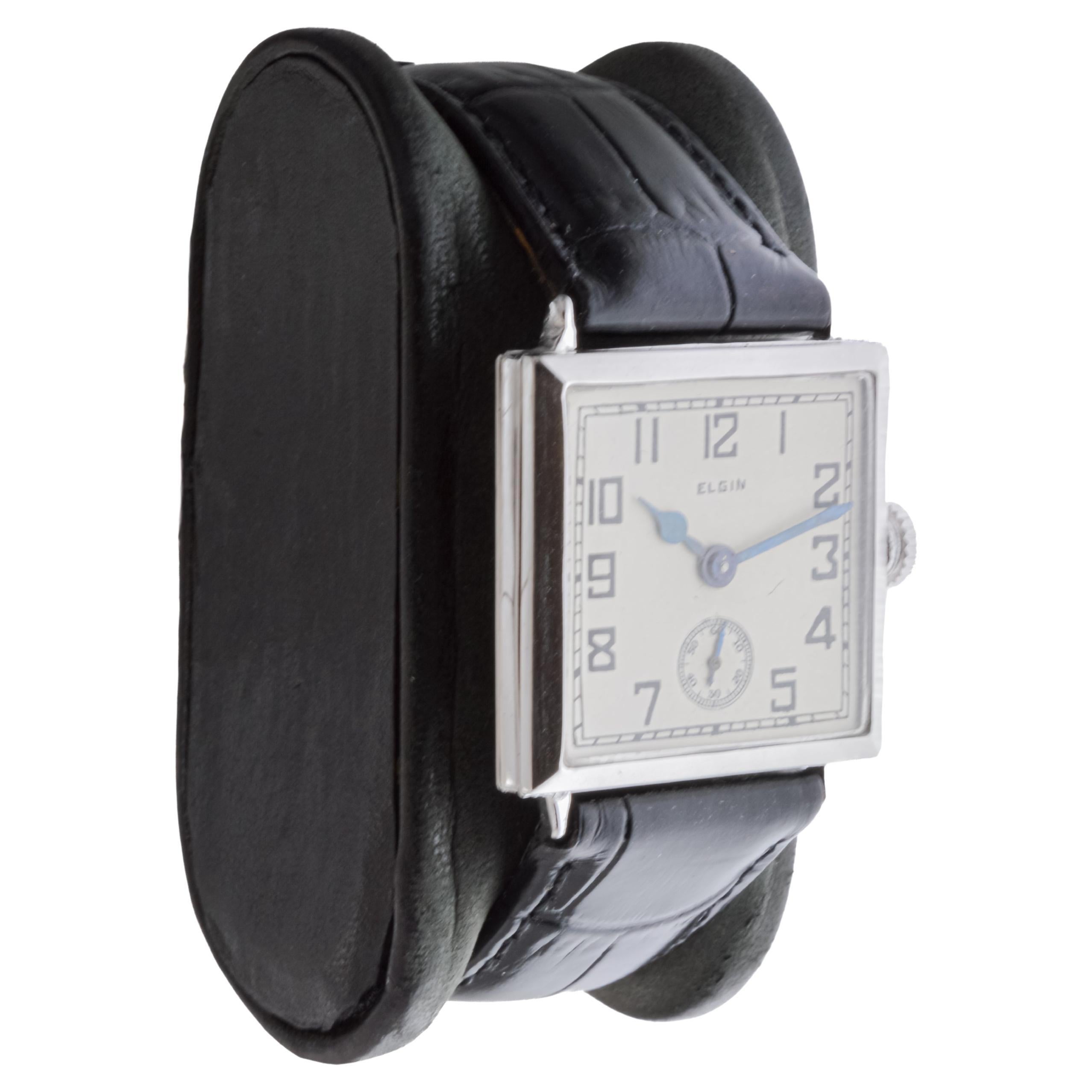 FACTORY / HOUSE: Elgin Watch Company
STYLE / REFERENCE: Art Deco / Square 
METAL / MATERIAL: White Gold Filled
CIRCA / YEAR: 1924
DIMENSIONS / SIZE: Length 34mm X Width 28mm
MOVEMENT / CALIBER: Manual Winding / Jewels / Caliber 6-0
DIAL / HANDS: