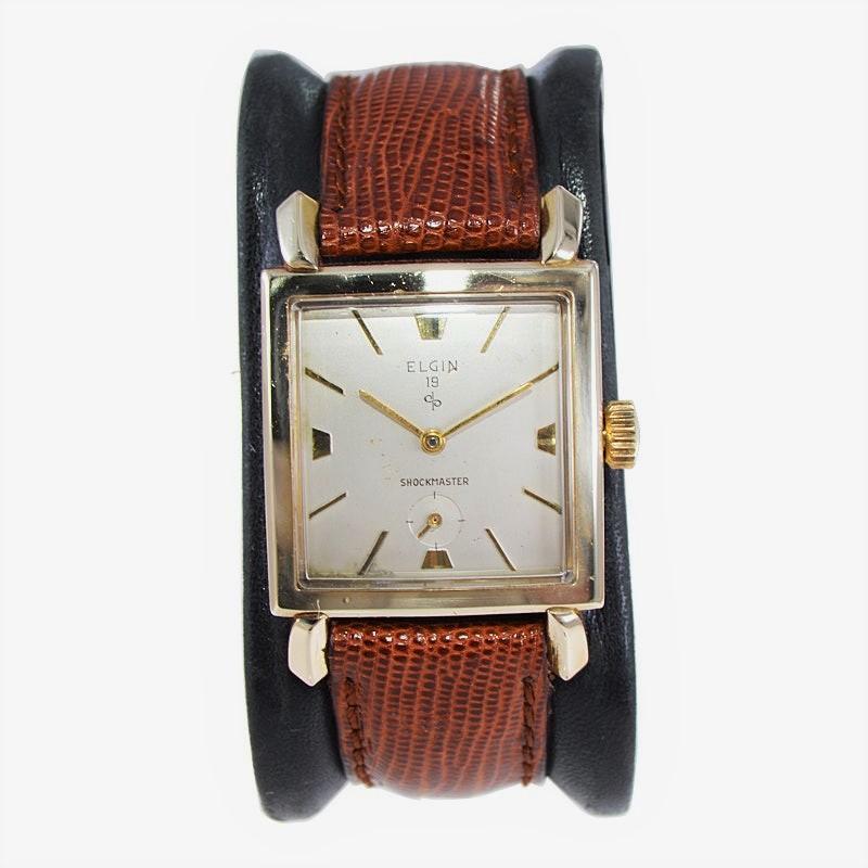 FACTORY / HOUSE: Elgin Watch Co.
STYLE / REFERENCE: Modern Art Deco
METAL / MATERIAL: 10K Yellow Gold Filled
CIRCA / YEAR: 1950's
DIMENSIONS / SIZE: Length 41mm x Width 28mm
MOVEMENT / CALIBER: Manual Winding / 21 Jewels / Cal.713
DIAL / HANDS: