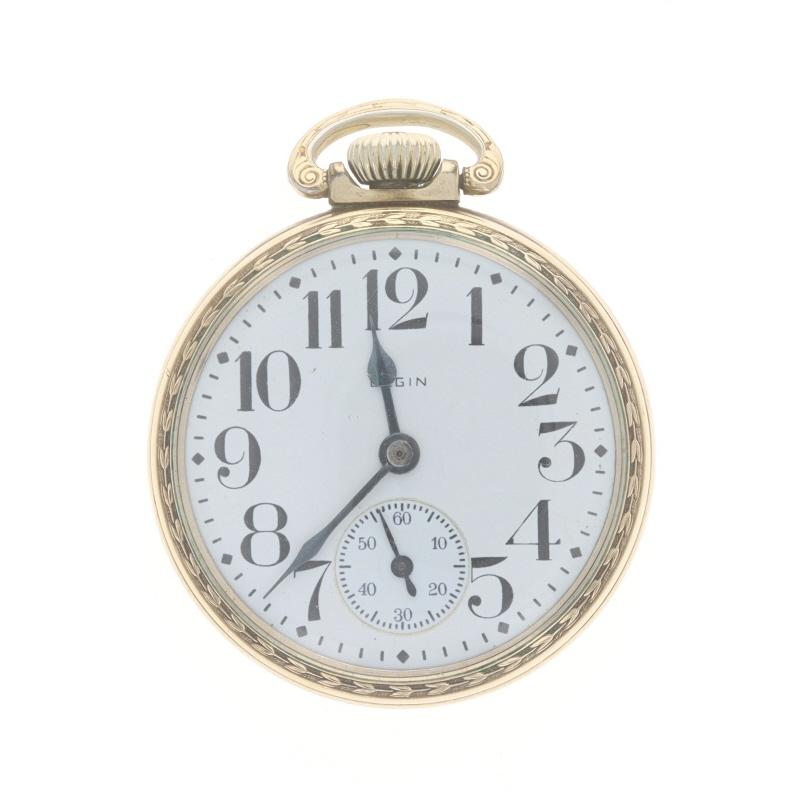Marke: Elgin
Modell: 7
Uhrwerk: Mechanisch
Anzahl der Juwelen: 15
Jahr: 1932
Hersteller des Uhrwerks: Vereinigte Staaten
Zifferblattfarbe: Weiß

Klasse: 313 
Größe: 16s 

Metallgehalt: 10k Gold gefüllt

Stil: Offenes Gesicht
Merkmale: 
Ziffern, die