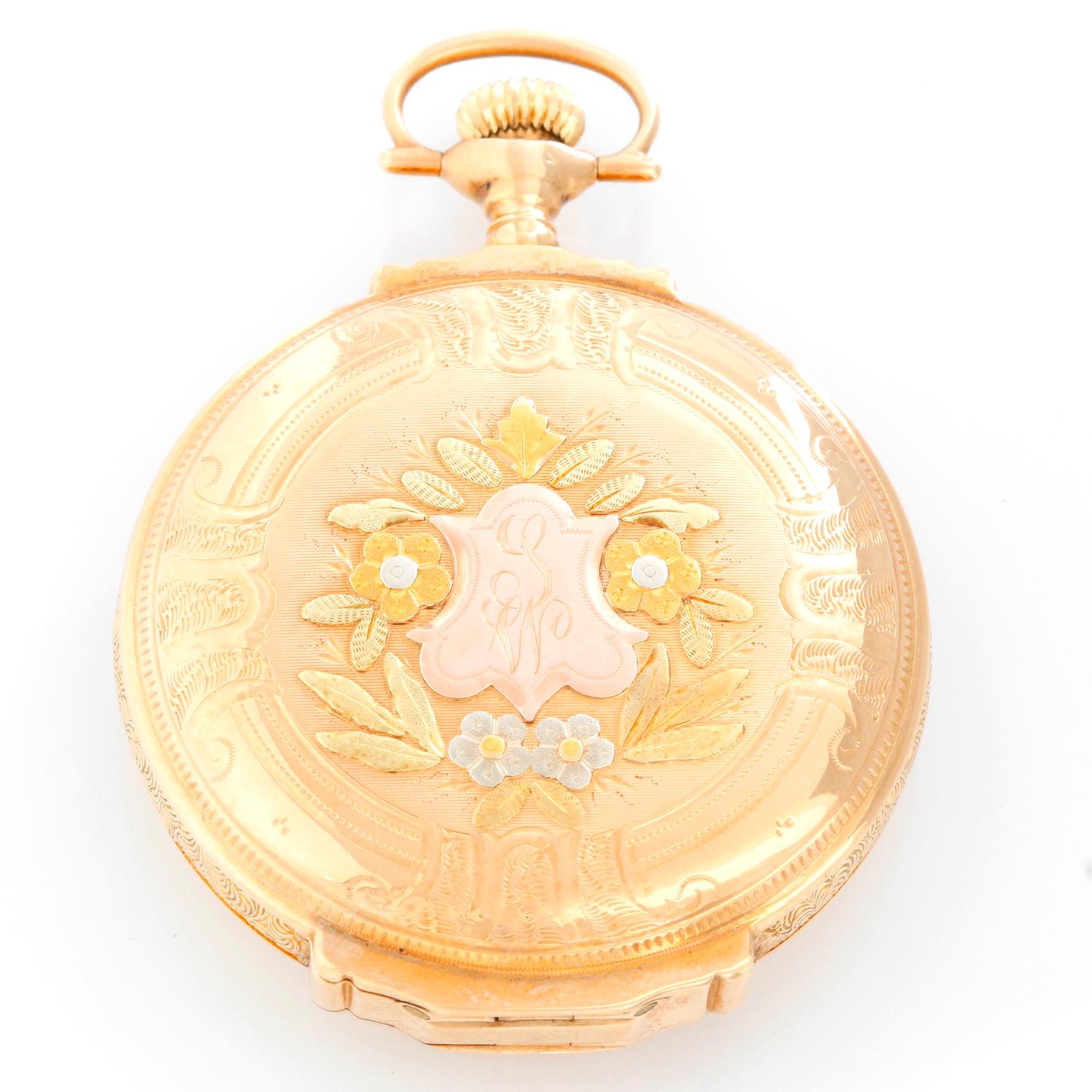 Elgin Multi Colored Box Hinged Gold  Pocket Watch - Manual winding. Multi colored yellow gold case (48mm) with a stag on the back side . White dial with skinny Roman numerals; subdial at 6 o'clock. Pre-owned with custom box .