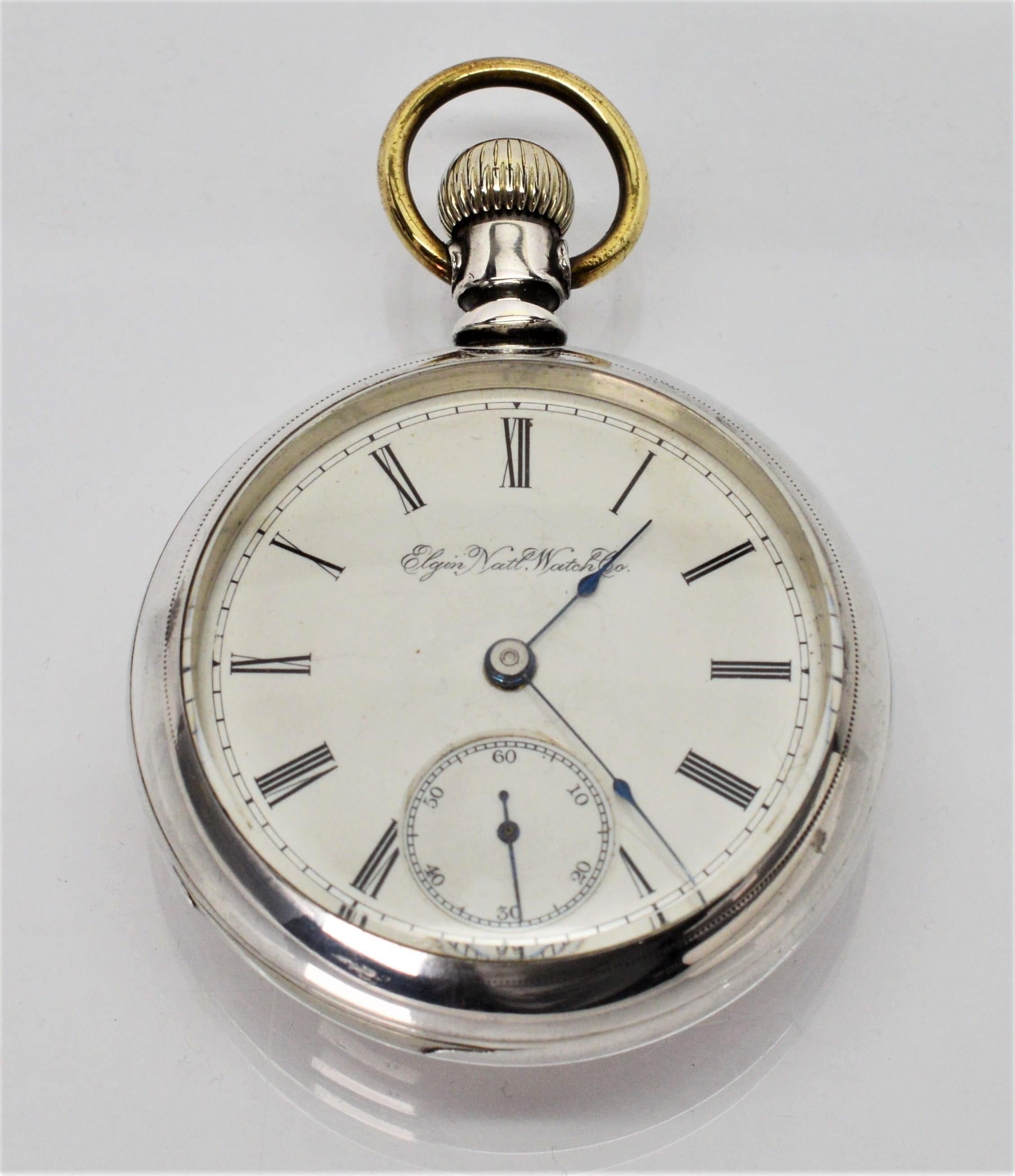 A beauty by Elgin National Watch Co. , circa 1890. With noticeable heft, this size 18S Model 5 Men's pocket watch is made with Fahys coin silver case #E656 and inlaid with a figure of a deer in gold on the case back. The white enamel face has Roman