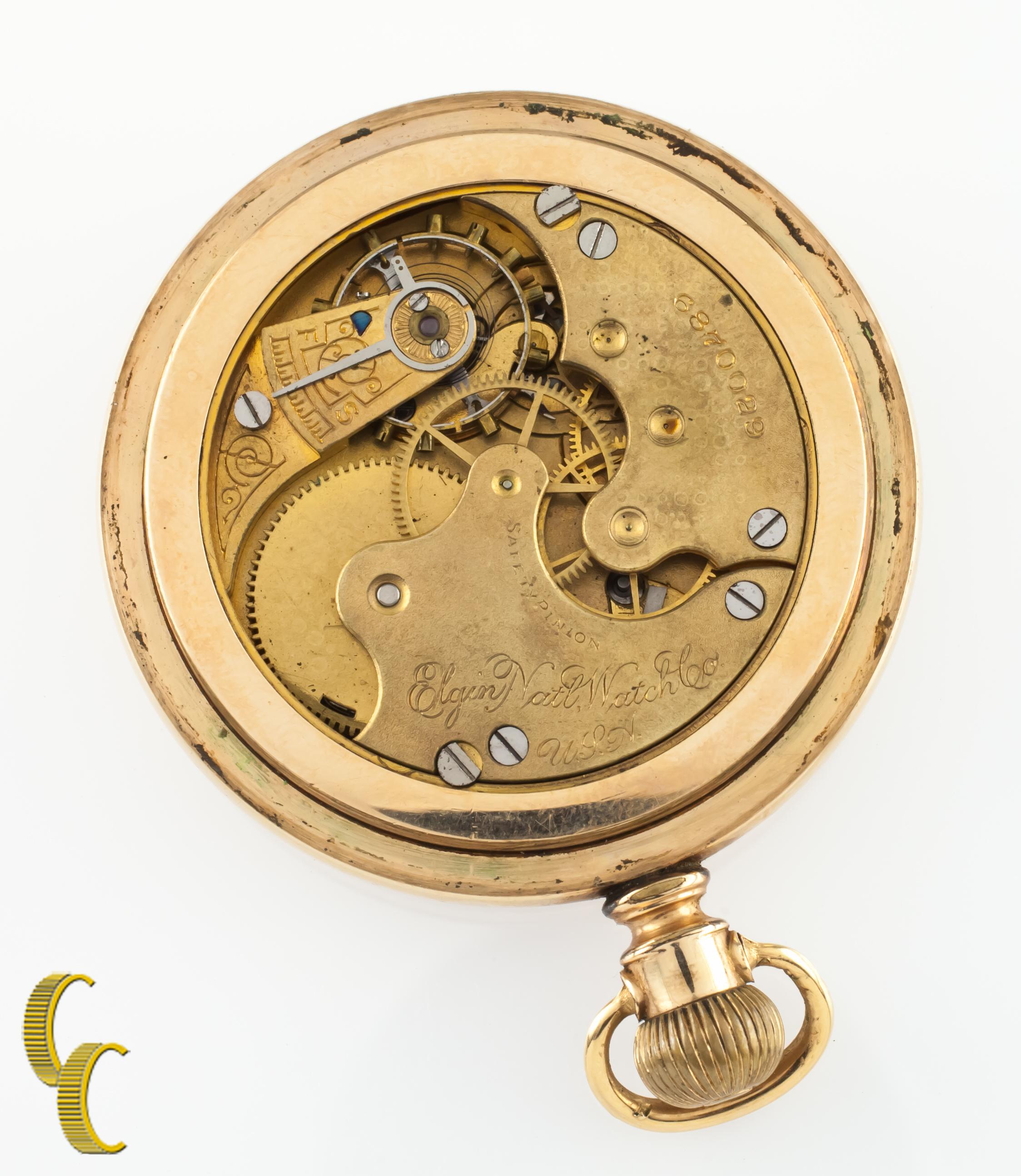 Beautiful Antique Elgin Pocket Watch w/ White Dial Including Blue/Black Hands 
14K Yellow GF Case w/ Intricate Hand-Etched Design on Case
Black Roman Numerals
Case Serial # 4542726
17-Jewel Elgin Movement Serial # 6870029
Grade # 117
Year of
