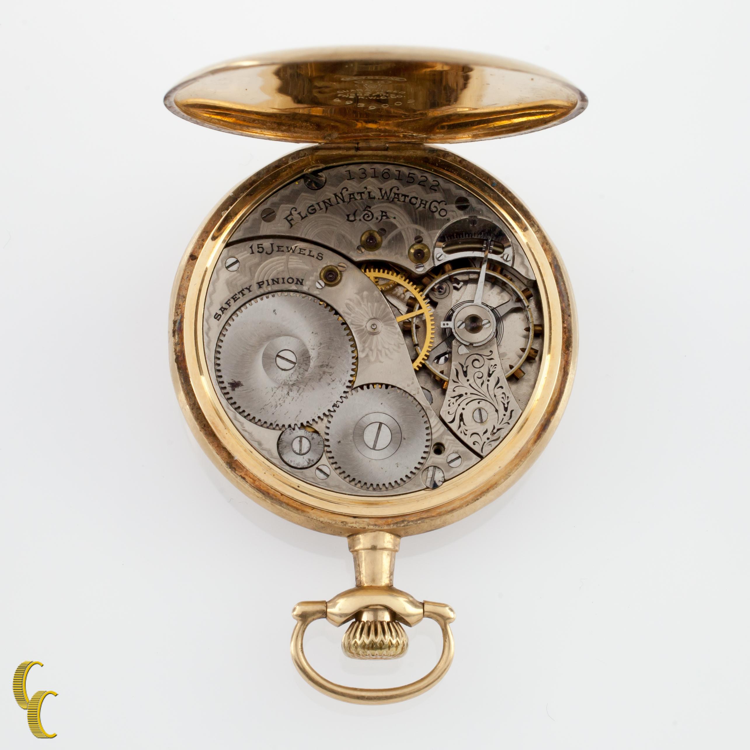 Beautiful Antique Elgin Pocket Watch w/ White Dial Including Gold Hands & Dedicated Second Dial
14k Yellow Solid Gold Case w/ Intricate Hand-Etched Feather Design on Reverse of Case
Gold Arabic Numerals
Case Serial #4939009
15-Jewel Elgin Movement