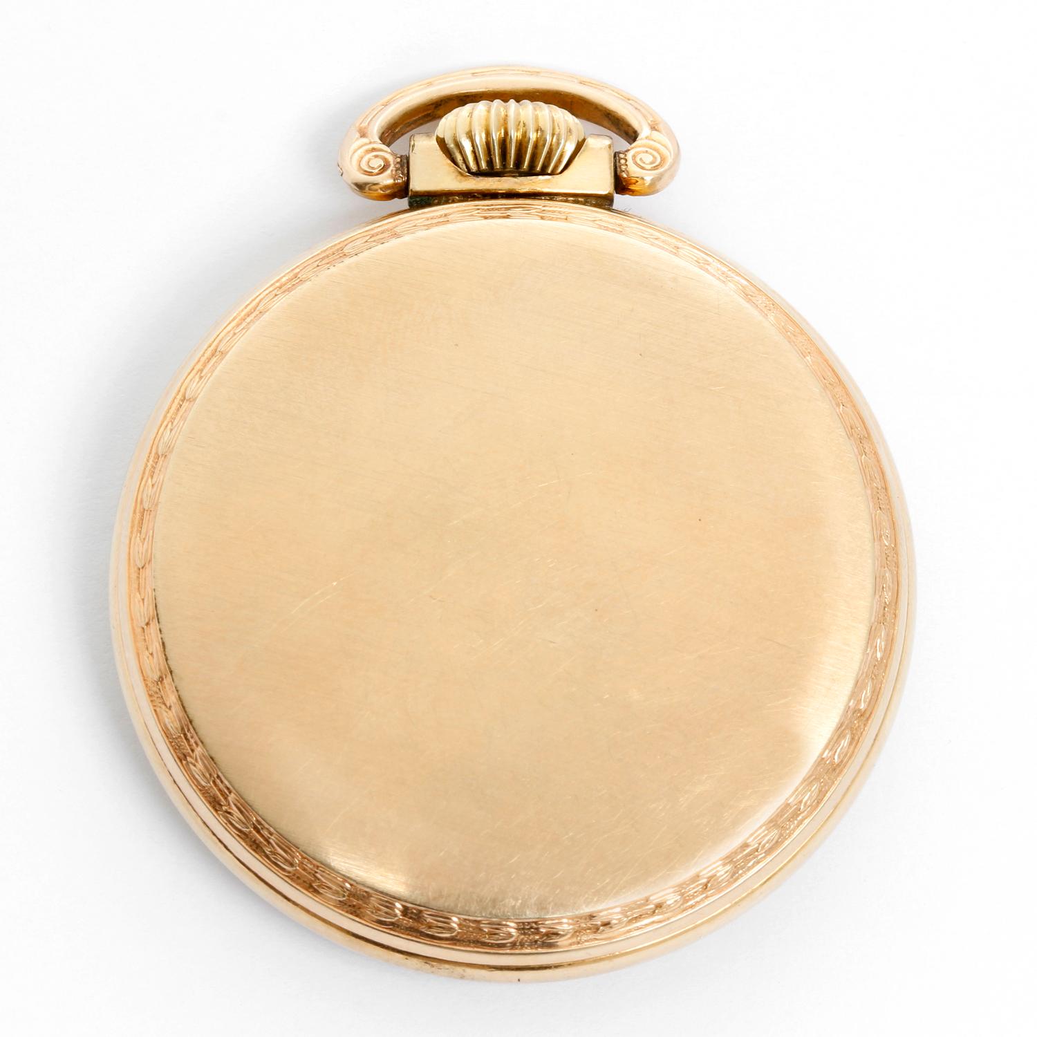 Elgin Pocket Watch - Manual. Gold filled. White enamel single sunk dial with Arabic numerals. Manual winding; 21 jewels. Gold filled . White enamel single sunk dial with Arabic numerals . Pre-owned with custom box. Railroad approved..