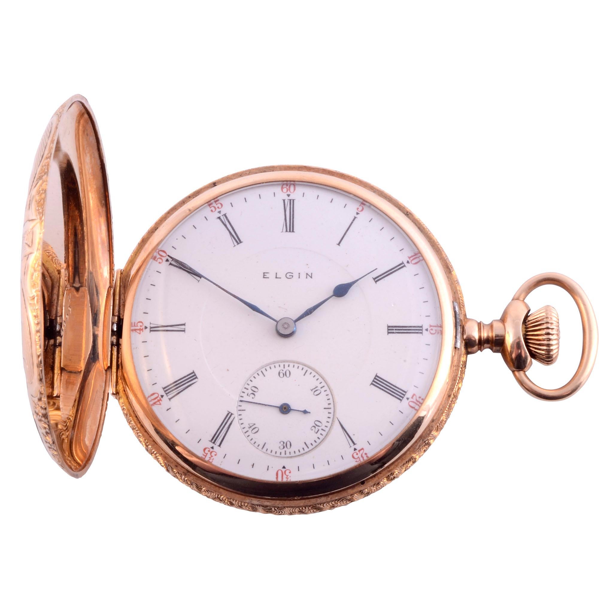 Antique American Elgin size 16 hunter case 14K gold pocket watch, circa 1898. This antique pocket watch is crafted in heavy 14 karat yellow gold by Elgin. The hunter case pocket watch is engraved with a palm tree motif and housed in a leather case.