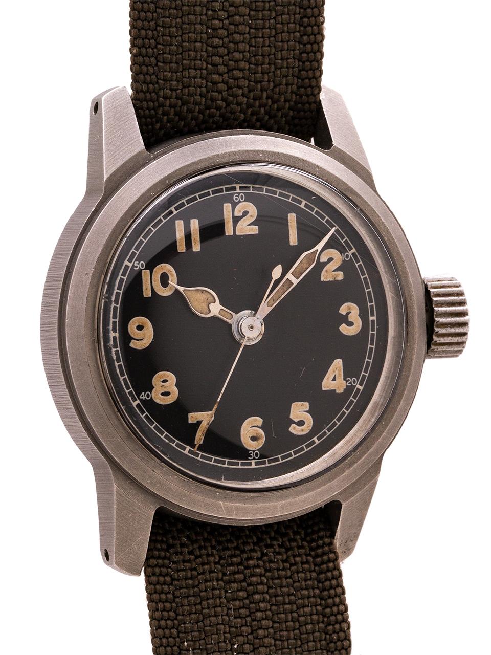 
Elgin WWII era U.S. Government issued wristwatch. 32mm case, matte black dial with arabic luminous numerals and hands. Screw down caseback engraved back, reading “U.S. GOV’T GRADE II. Featuring the manual wind Caliber 805 with sweep seconds.

Fully