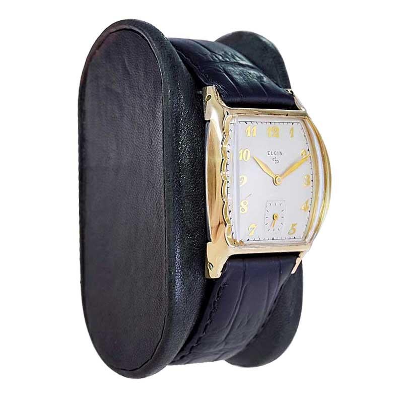 FACTORY / HOUSE: Elgin Watch Company 
STYLE / REFERENCE: Art Deco / Tonneau Shape
METAL / MATERIAL: Yellow Gold Filled
CIRCA / YEAR: 1940's
DIMENSIONS / SIZE: Length 36mm X Width 26mm
MOVEMENT / CALIBER: Manual Winding / Jewels / Caliber 683
DIAL /