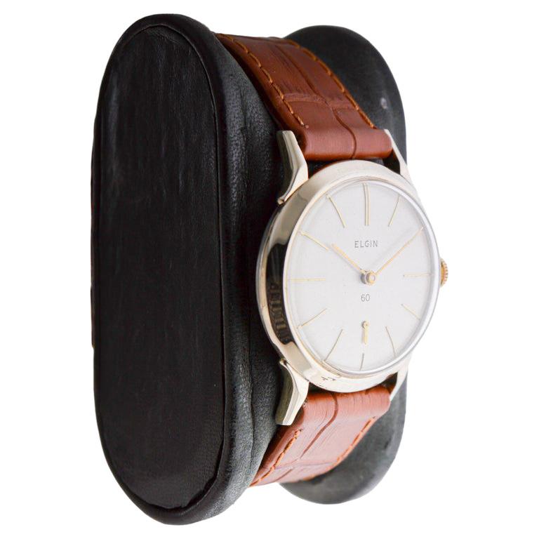 FACTORY / HOUSE: Elgin Watch Company
STYLE / REFERENCE: Art Deco / Round 
METAL / MATERIAL: Yellow Gold Filled
CIRCA / YEAR: 1950's
DIMENSIONS / SIZE: 39mm Length X 31mm Diameter
MOVEMENT / CALIBER: Manual Winding / 19 Jewels / Caliber 711 
DIAL /