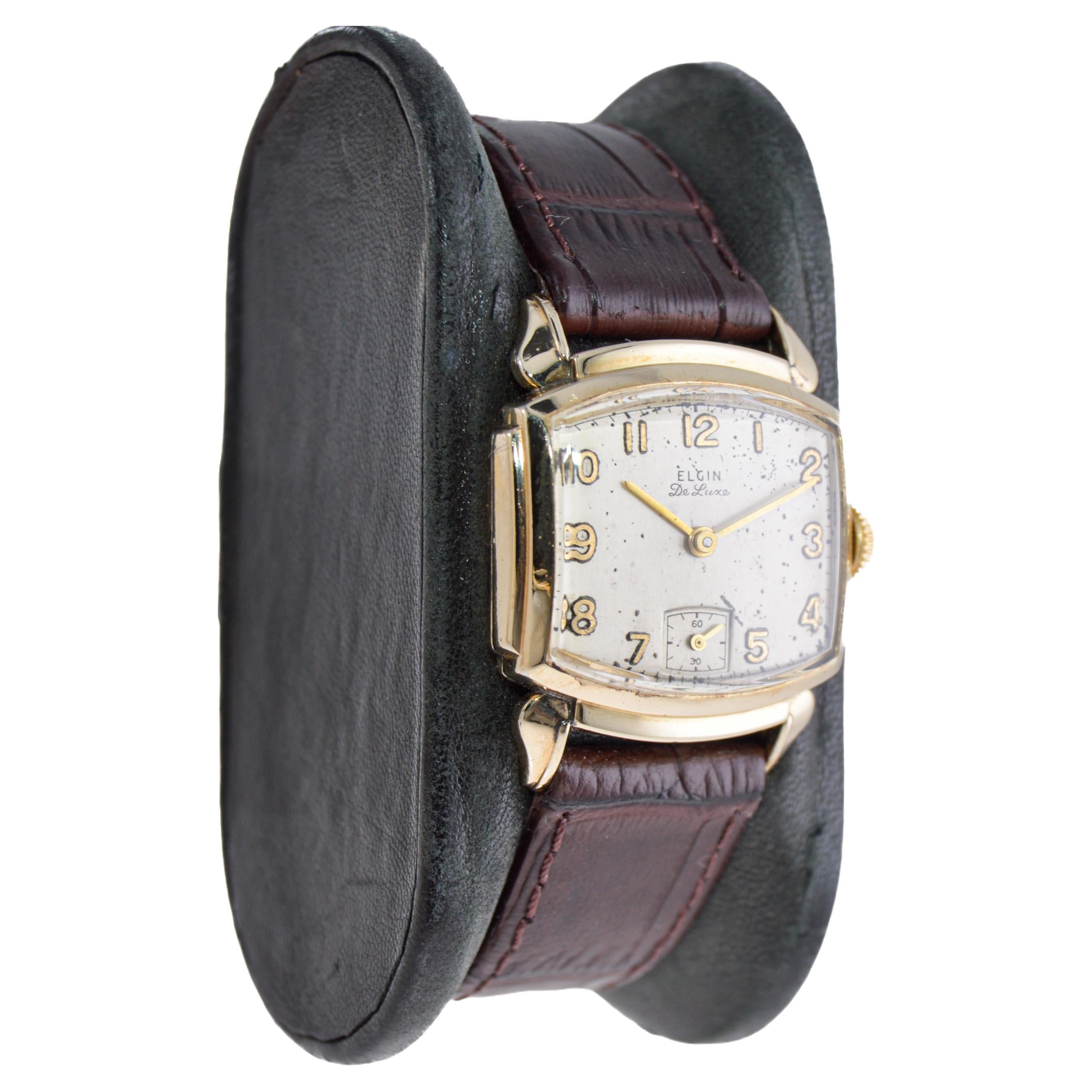 FACTORY / HOUSE: Elgin Watch Company
STYLE / REFERENCE: Art Deco / Modified Tortue Shape
METAL / MATERIAL: Yellow Gold-Filled
CIRCA / YEAR: 1940's
DIMENSIONS / SIZE: 32mm Length X 26mm Diameter
MOVEMENT / CALIBER: Manual Winding / 17 Jewels  
DIAL /