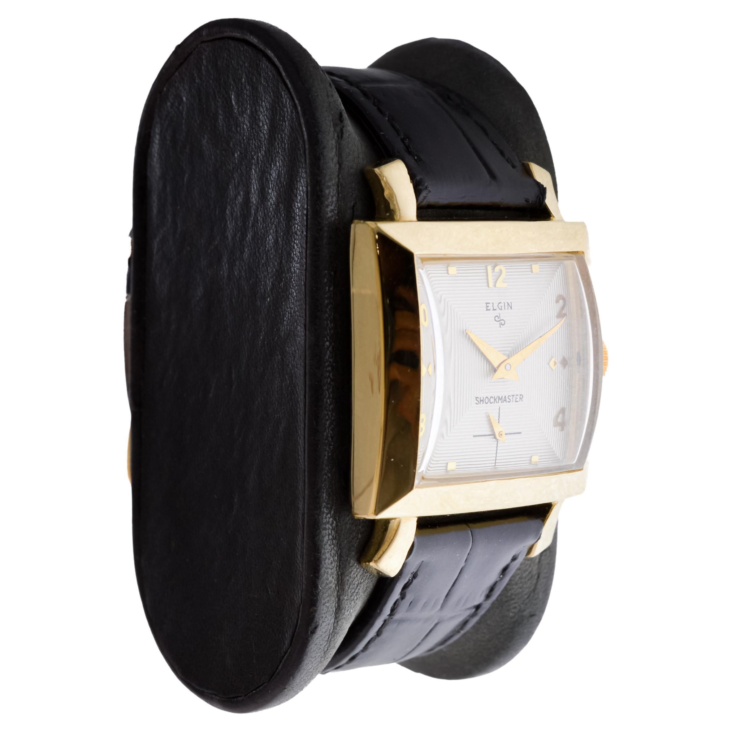 FACTORY / HOUSE: Elgin Watch Company
STYLE / REFERENCE: Shockmaster / Reference 6761
METAL / MATERIAL: Yellow Gold Filled
CIRCA / YEAR: 1950's
DIMENSIONS / SIZE: Length 40mm X Width 28mm
MOVEMENT / CALIBER: Manual Winding / 17 Jewels / Caliber 587
