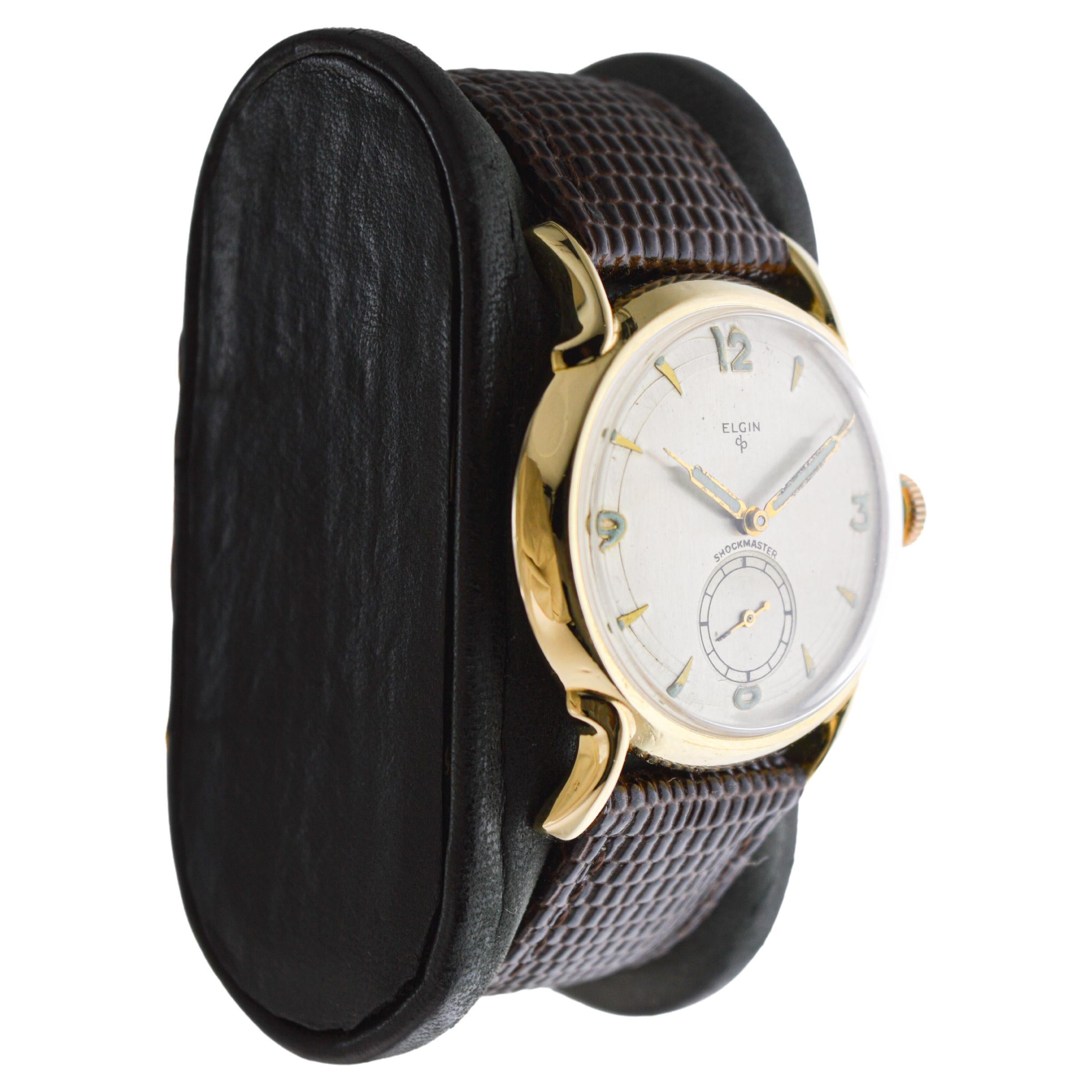 FACTORY / HOUSE: Elgin Watch Company
STYLE / REFERENCE: Art Deco / Shockmaster
METAL / MATERIAL: Yellow Gold Filled 
CIRCA / YEAR: 1950's
DIMENSIONS / SIZE: Length 39mm X Diameter 32mm
MOVEMENT / CALIBER: Manual Winding / 17 Jewels / Caliber 
DIAL /
