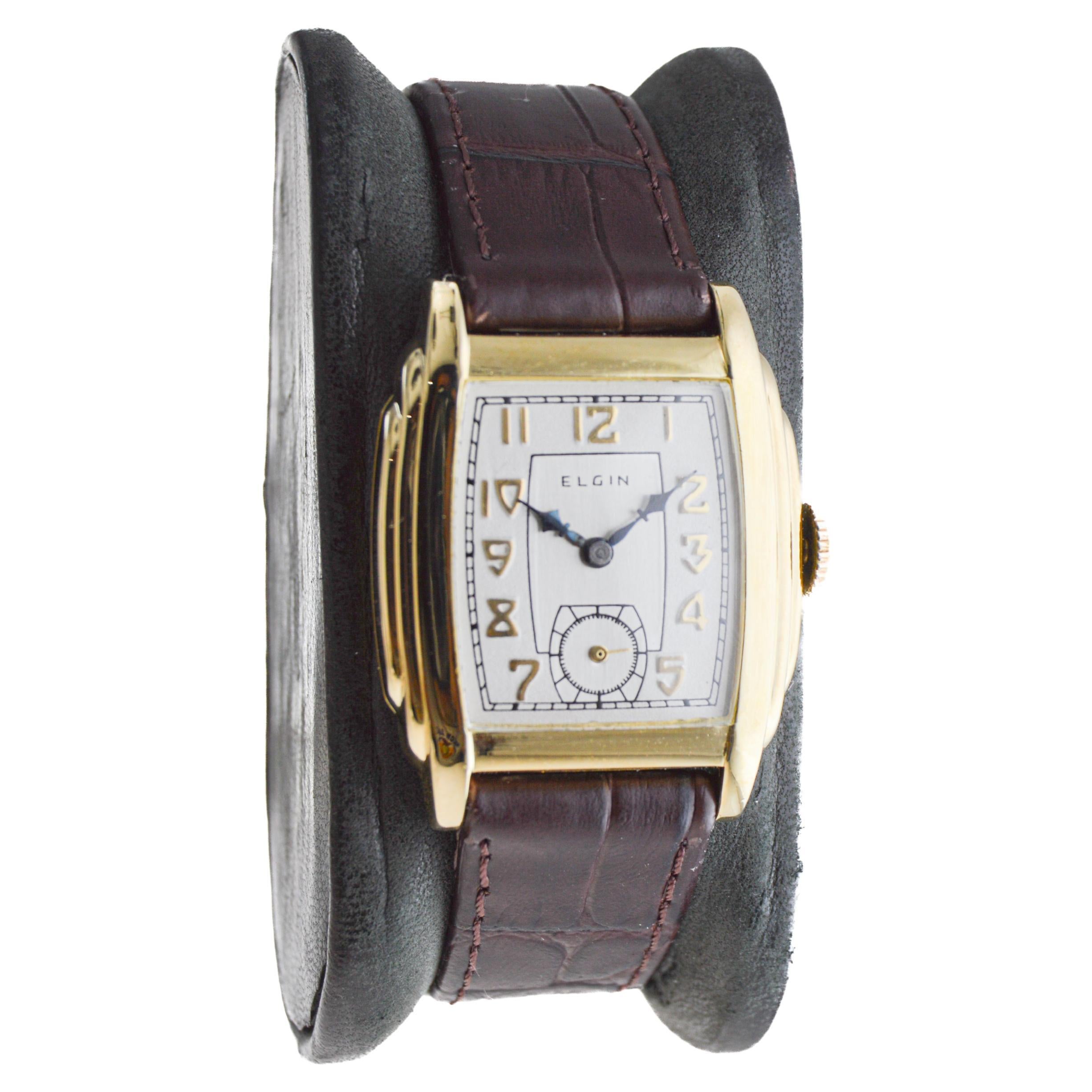 FACTORY / HOUSE: Elgin Watch Company
STYLE / REFERENCE: Art Deco / Tonneau Shape
METAL / MATERIAL: Yellow Gold Filled
CIRCA / YEAR: 1931
DIMENSIONS / SIZE: Length 27mm X Width 35mm
MOVEMENT / CALIBER: Manual Winding / 19 Jewels / Caliber 6/0