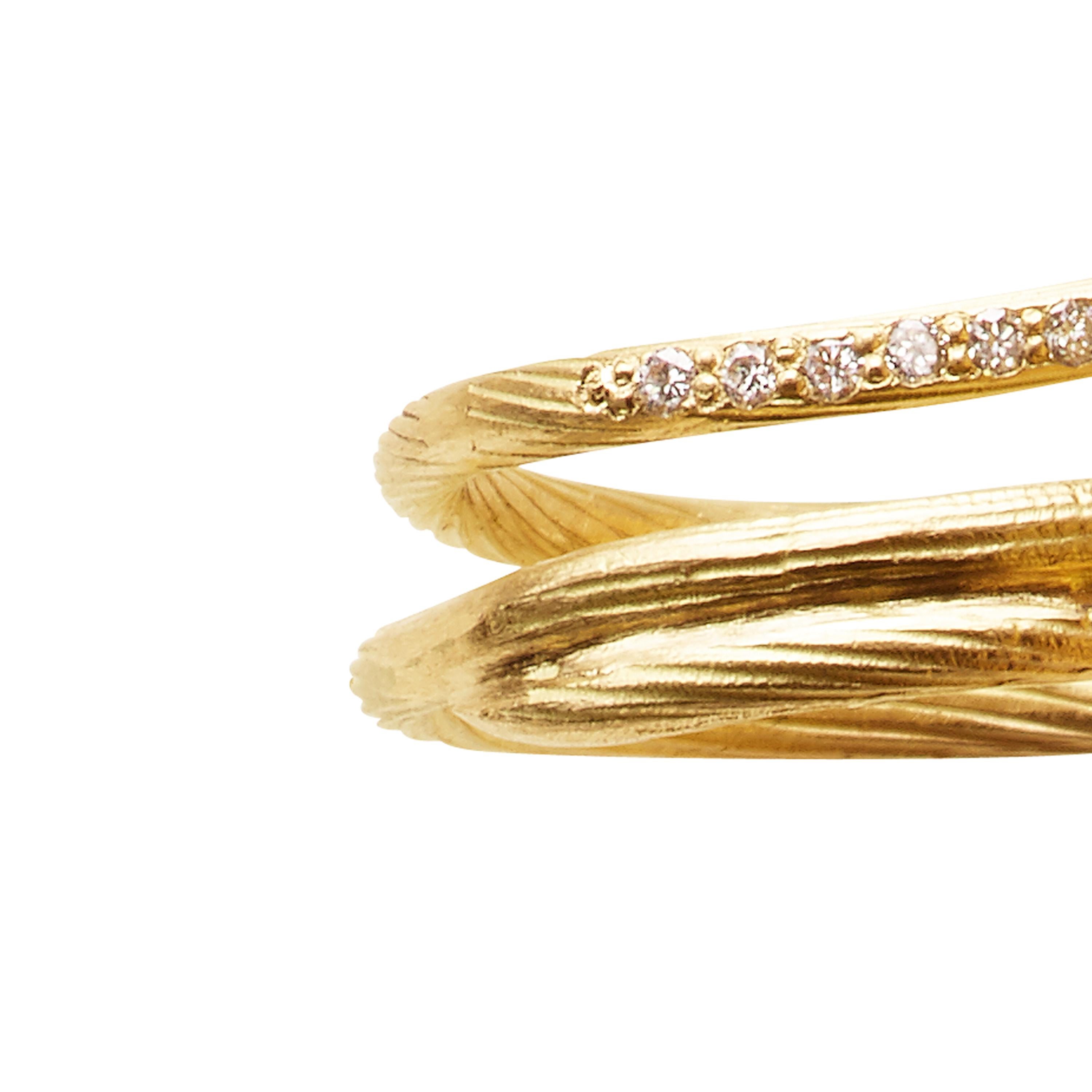 18K Yellow Gold Abyss Fishtale Ring with 10 x Top Wesselton VVS Diamonds [0.10CT]  It is beautiful on its own, and combined with other rings. 

Each piece is unique and handmade upon request in our Copenhagen studio. 

This collection brings the