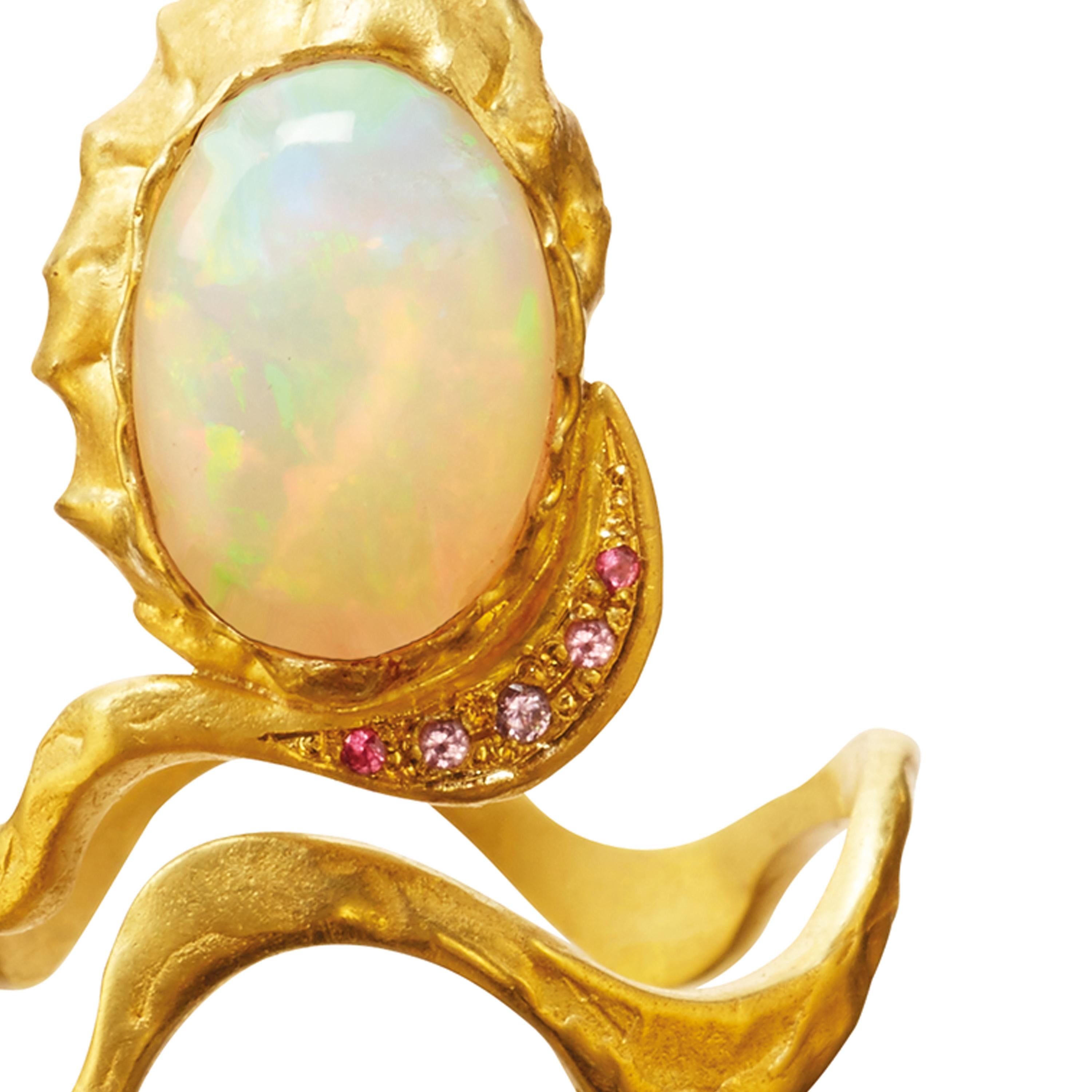 The Opal Eye ring is handcrafted in 18k gold, studded with 5  x spinels & 1 white water opal. It is beautiful on its own or combined with other ELHANATI rings.

The ring is from Mark Me Pink, the second edition of Mark Me Sky, inspired by the latest