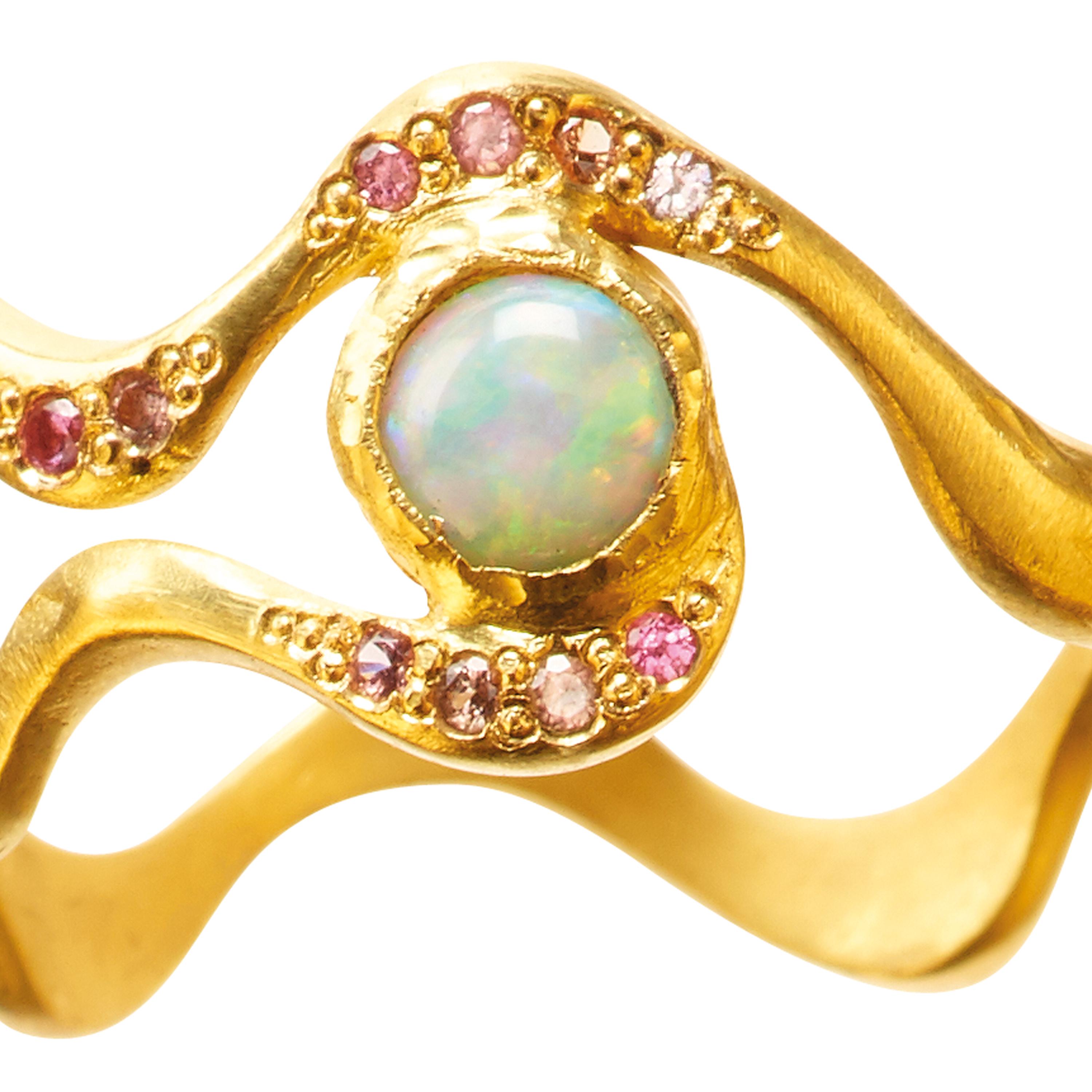 The Opal Eye ring is handcrafted in 18k gold, studded with 10 x spinels & 1 white water opal. It is beautiful on its own or combined with other ELHANATI rings.

The ring is from Mark Me Pink, the second edition of Mark Me Sky, inspired by the latest
