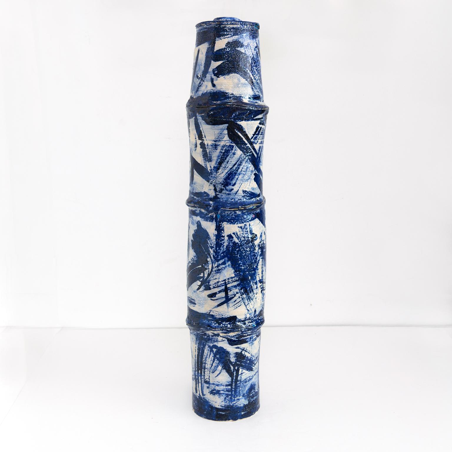 A tall contemporarty Scandinavian Modern unique studio vase by artist Eli Keller. Made of stoneware, partly white / blue glazed, in the form of a stem of bamboo. The artist has taken inspiration from a journey in 2018 to Jingdezhen,