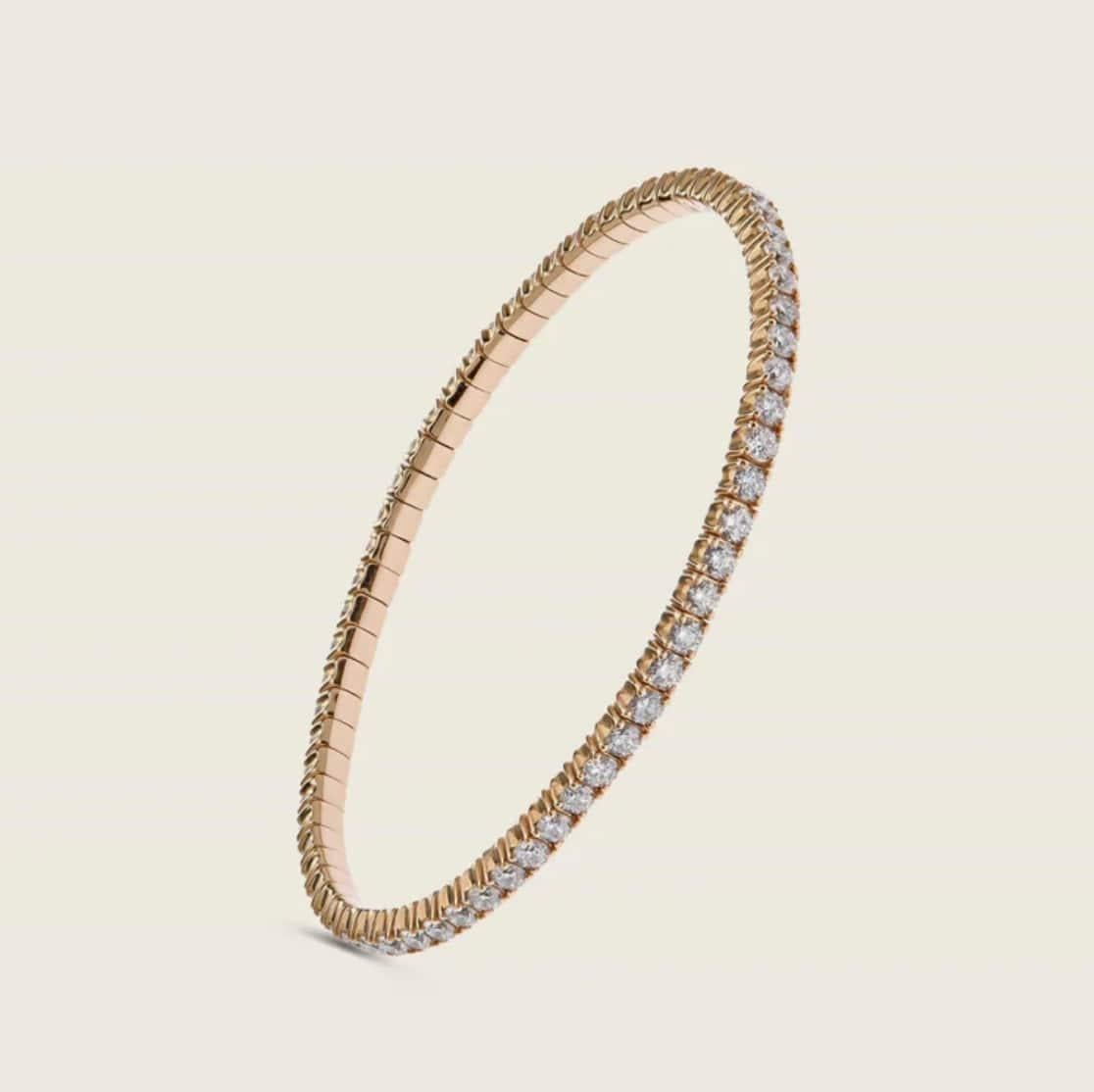 This stunning stretch bangle features four-prong set round brilliant diamonds totaling 4.64 carats. A versatile and elegant diamond tennis bracelet, this piece fits many wrist sizes and is meticulously manufactured in Italy, making it a must-have