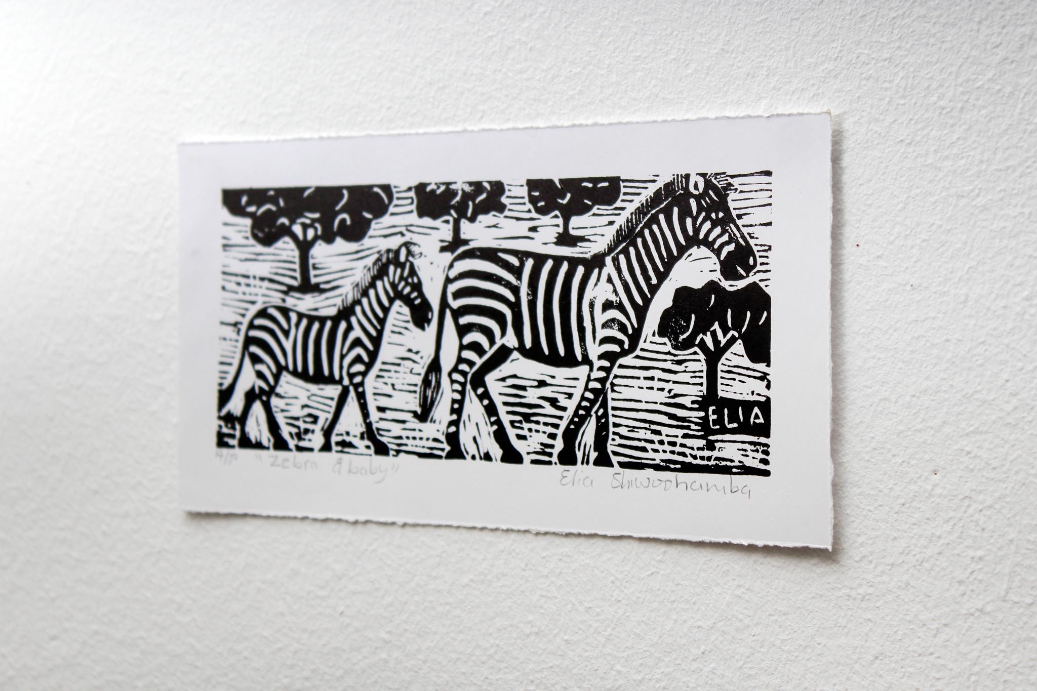 Zebra and baby, Linoleum block prints on paper.

Elia Shiwoohamba was born in 1981 in Windhoek, Namibia. He graduated from the John Muafangejo Art Centre in Windhoek in 2006. Specialising in printmaking and sculpture, Shiwoohamba works as a
