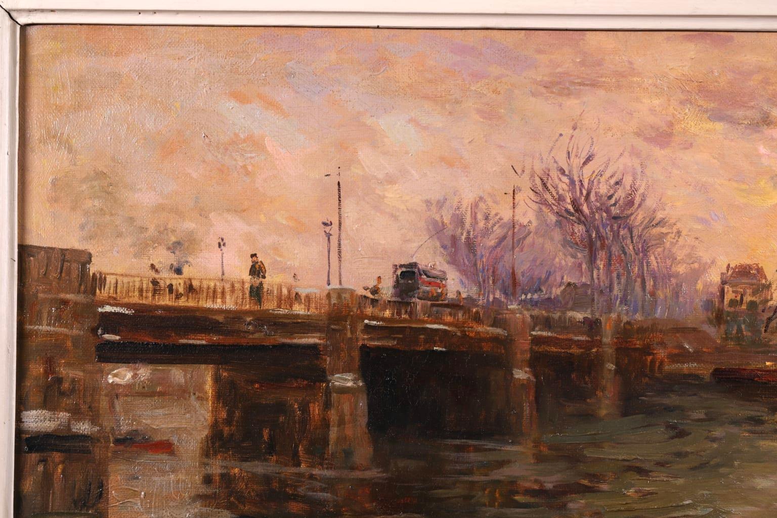 A simple and wonderful oil on canvas riverscape circa 1910 by Russian impressionist painter Elie Anatole Pavil. The work depicts a view of a bridge over the River Seine in France. The sunset illuminates the cloudy winter sky in yellows and peaches
