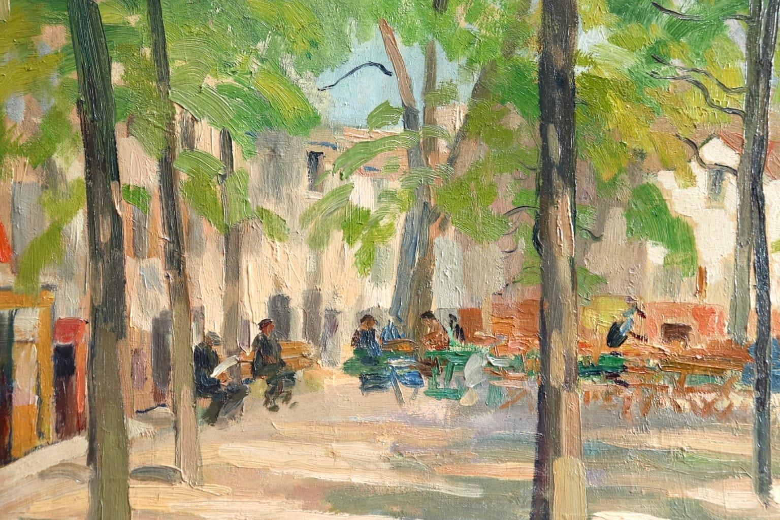 A beautiful oil on canvas circa 1910 by Russian painter Elie Anatole Pavil depicting a view of Place du Tertre in Montmartre, France. The sun shines through the green trees and people enjoy breakfast al fresco in the warm