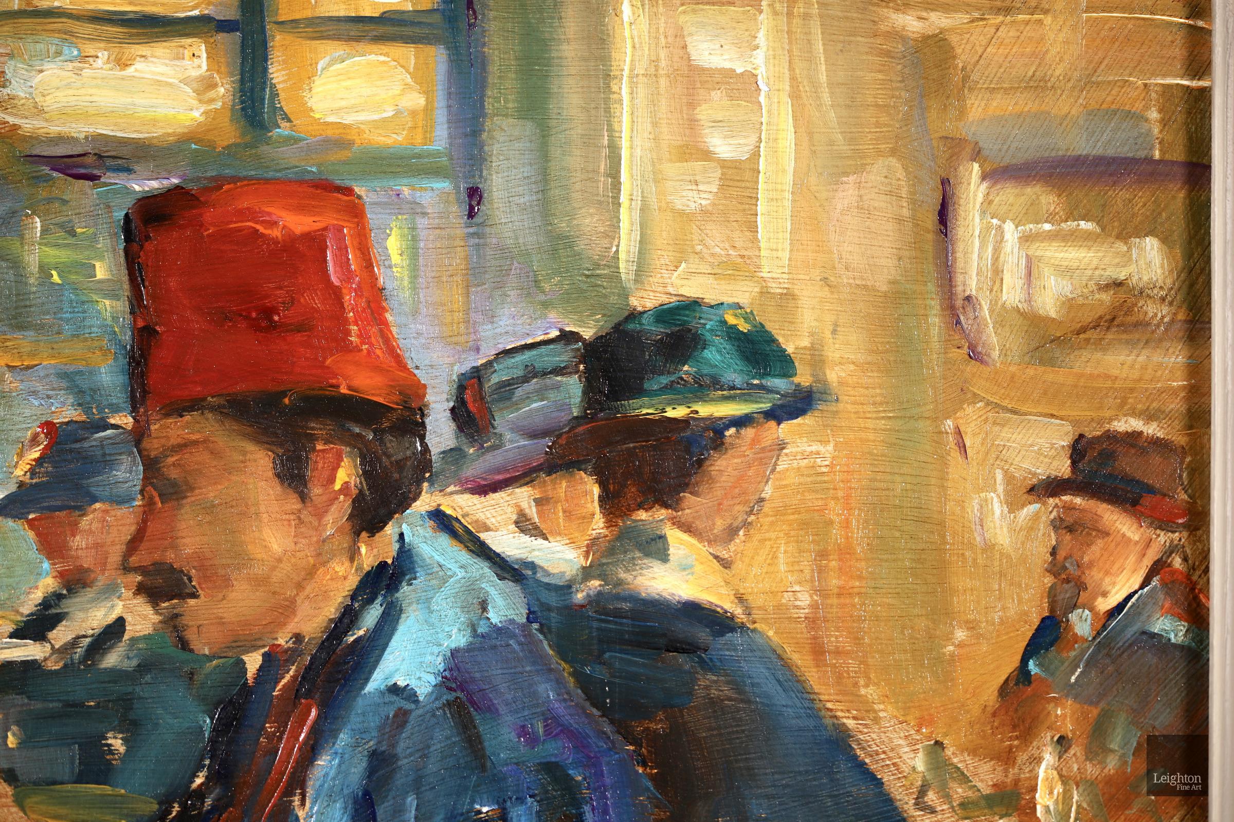 Signed figures in interior oil on panel circa 1940 by Russian-born post impressionist painter Elie Anatole Pavil. The piece a couple both wearing hats deep in conversation in a busy Parisian cafe. 

Signature:
Signed lower right

Dimensions:
Framed:
