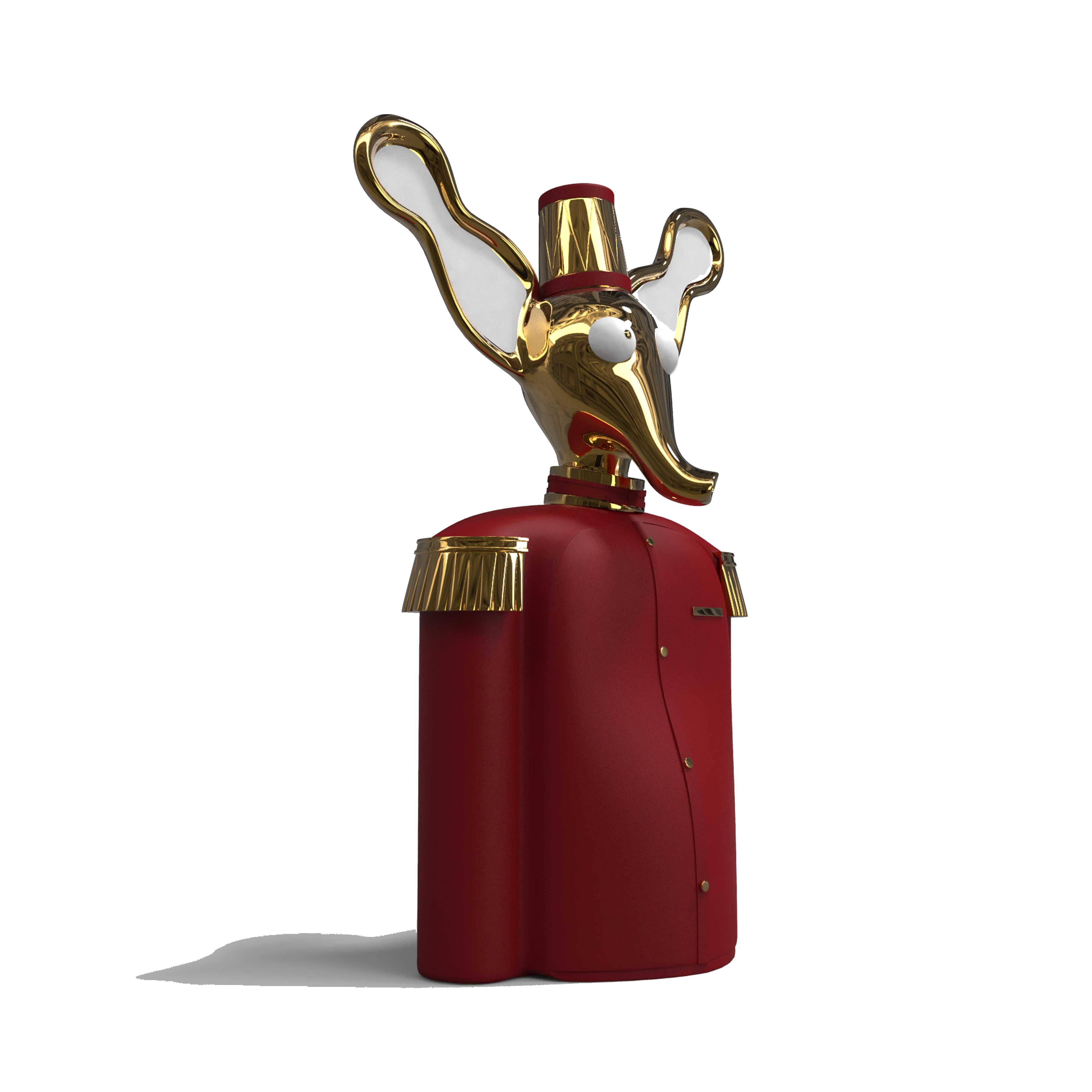 Elie red brass elephant bar storage cabinet by Matteo Cibic is a grand elephant with a lovable brass head and a smart red uniform. It opens up as a fantastic sculptural cabinet.

“Until one has loved an animal, a part of one’s soul remains