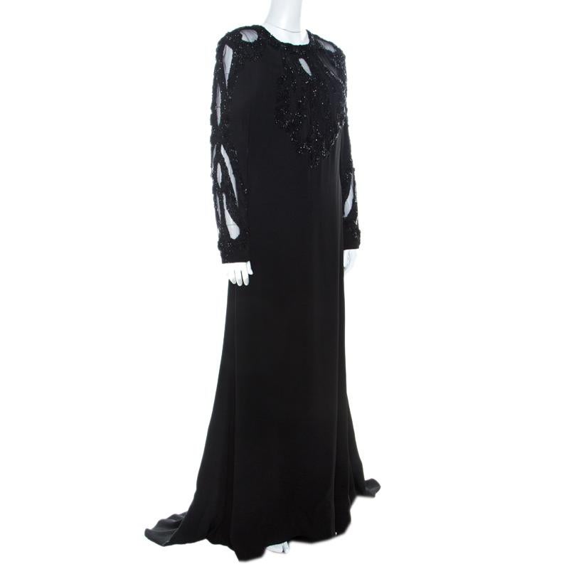 Elie Saab design their elegant evening wears with subtle hints of glamor. This black gown features an embellished bodice and a full-length bottom embellished. It is tailored in a silk blend and styled with long cut-out sleeves and zip closure at the