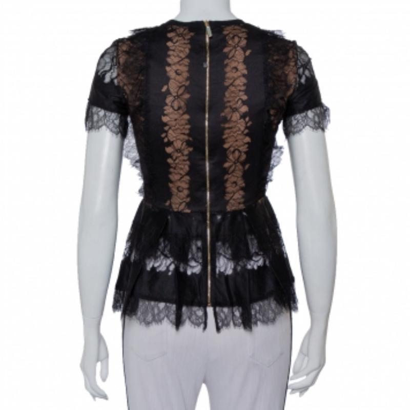 This top from Elie Saab will surely be a closet darling. The lace top is styled with short sleeves, contrast lining, and a back zipper. While the lace gives off a feminine vibe, the peplum detail adds to the beauty of its structure and makes it a