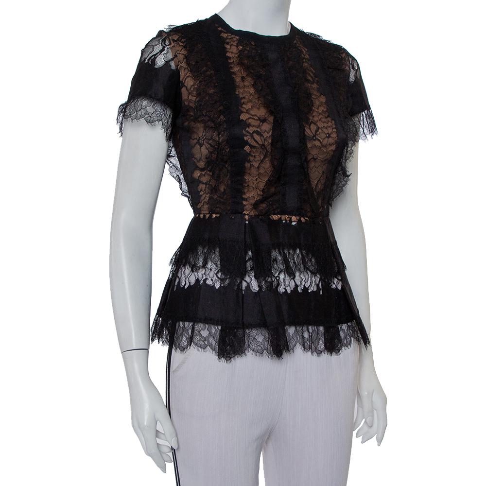 This top from Elie Saab will surely be a closet darling. The lace top is styled with short sleeves, contrast lining, and a back zipper. While the lace gives off a feminine vibe, the peplum detail adds to the beauty of its structure and makes it a