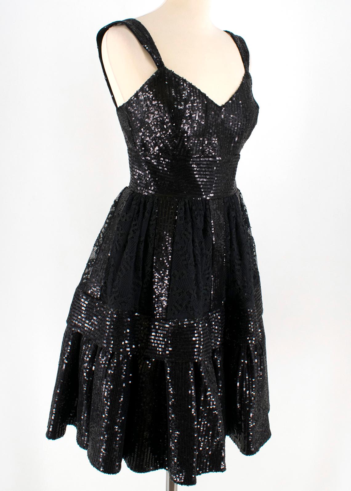 Ellie Saab Black Sequin & Lace Dress 

- black sequin dress
- lace embellishment to the skirt
- sleeveless
- v neckline 
- lined
- double zip fastening to the back 

This seller usually wear size XS. 

Please note, these items are pre-owned and may