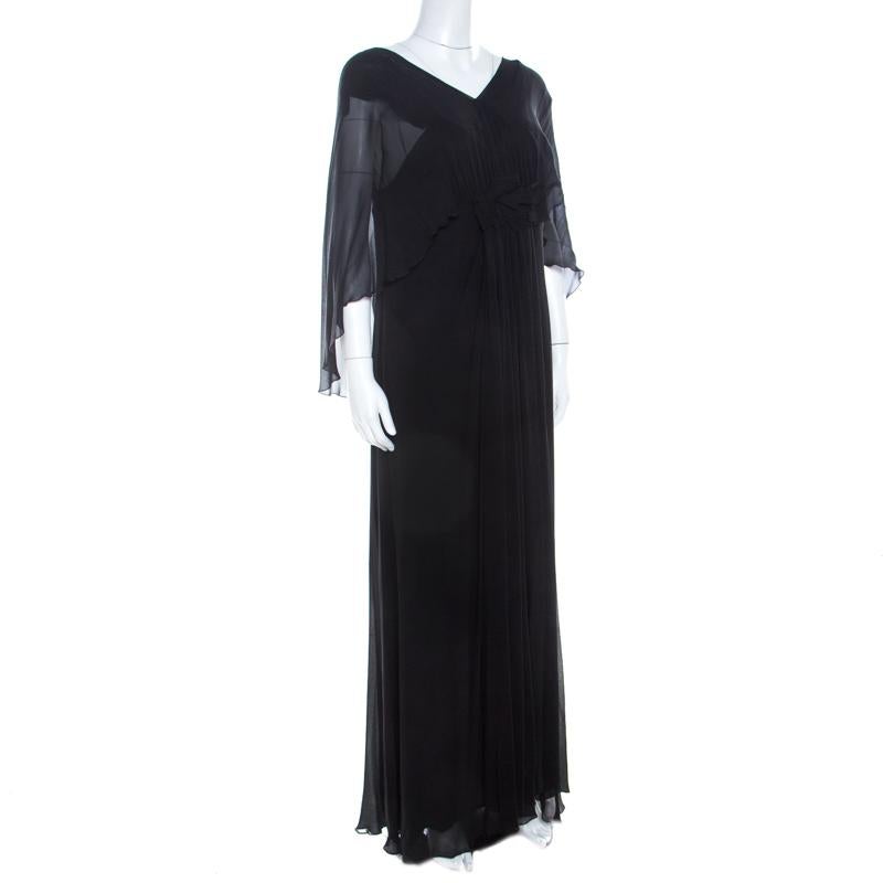 Pick this dress when you want to be an attention grabber at the party. Designed for luxury, this lovely gown has a draped bodice with ruffle detailing and it falls to a flouncy bottom accented with pleats. The cape sleeves add to the feminity of
