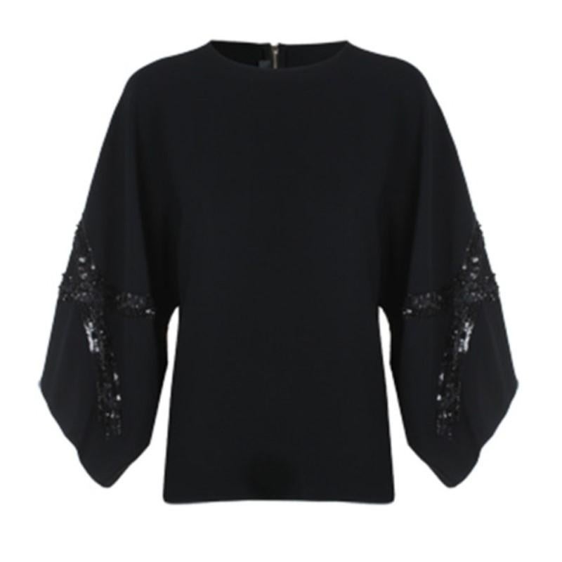 Whether worn to a morning brunch or an evening dinner, this Elie Saab AW14 top will leave you at the top of the social ladder. Its classic black color is designed with a round neckline and wide sleeves embellished with black sequins. This top