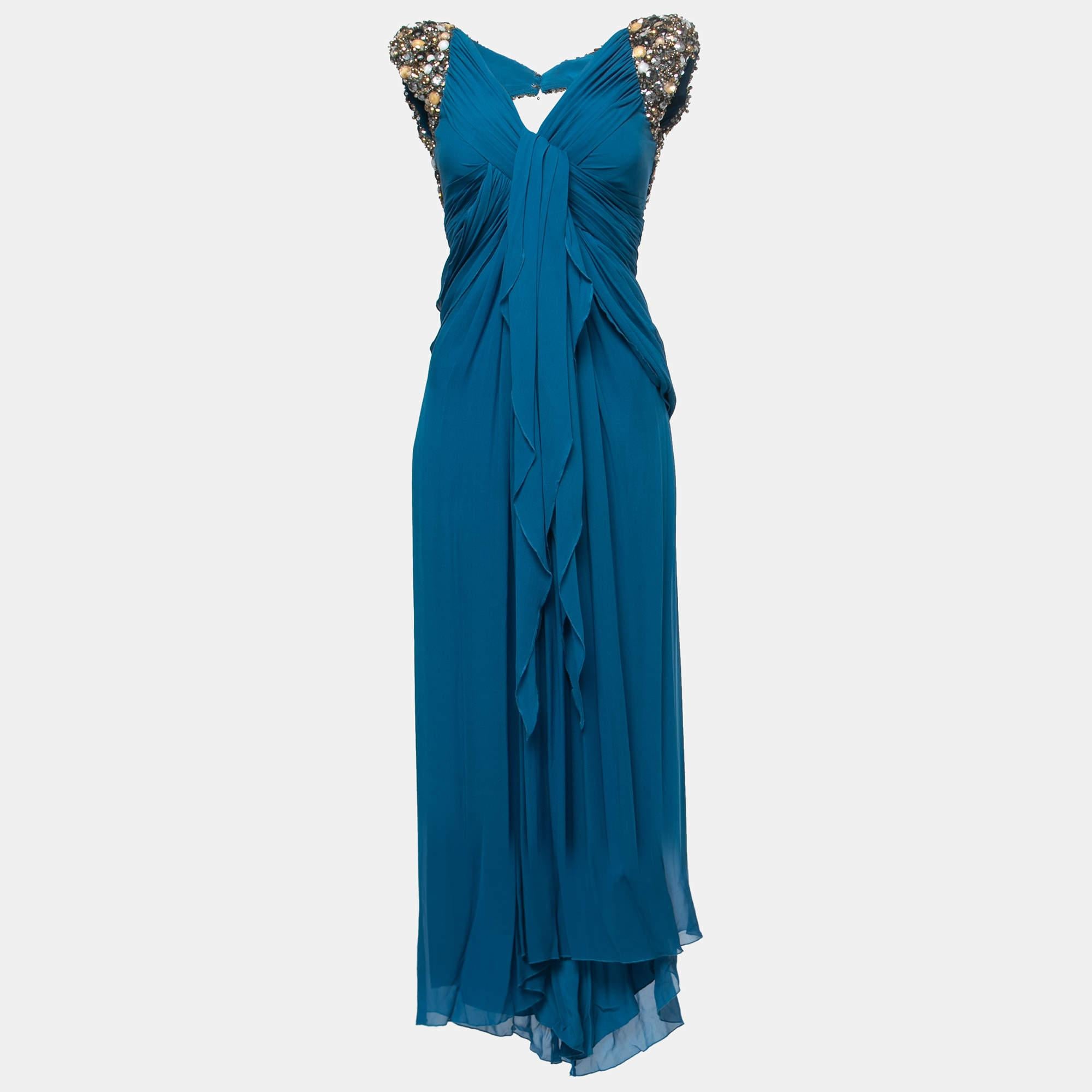Created with embellished panels and elegant drapes, this Elie Saab sleeveless gown has a feminine look and a beautiful silhouette. It is sewn for a comfortable fit and finished with a zipper.

Includes: Original Dustbag, hanger
