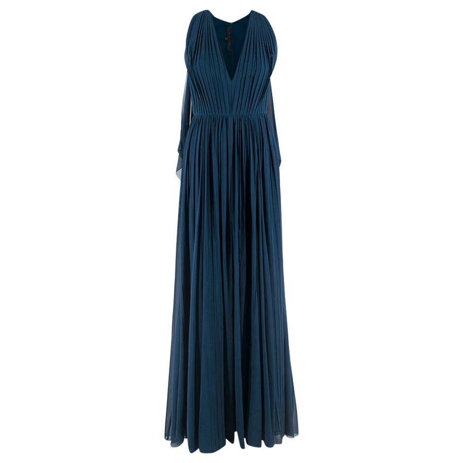Elie Saab Blue Pleated silk-chiffon gown

- Flowy panels on back
- Zipper and hook in good condition
- Thin belt at waist
- Sewn line detail
- Sleeveless; v-neck

Please note, these items are pre-owned and may show signs of being stored even when